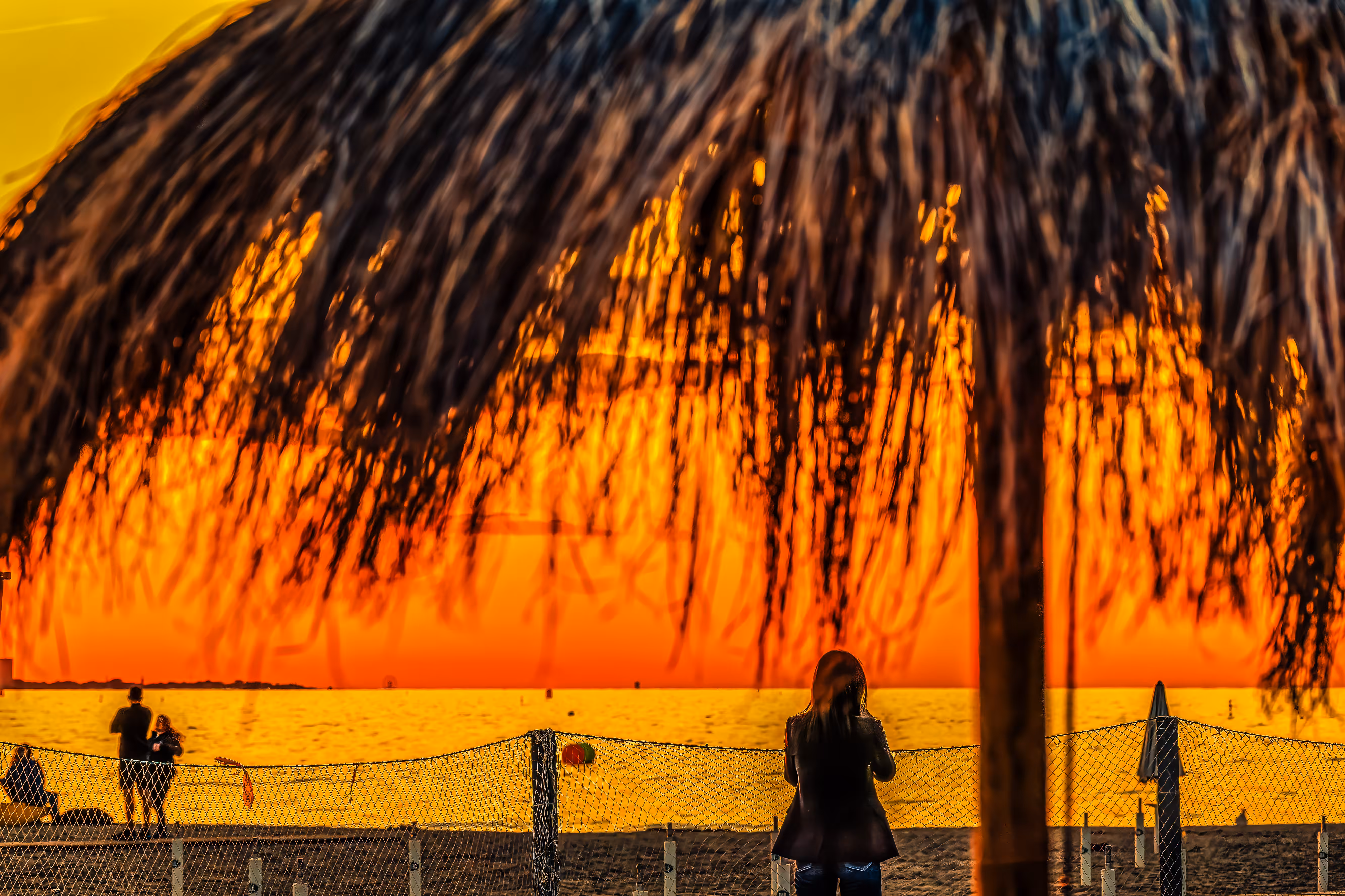 Beach Photography – Sunset Under Palapa, Cattolica #SunsetMagic #CoastalView