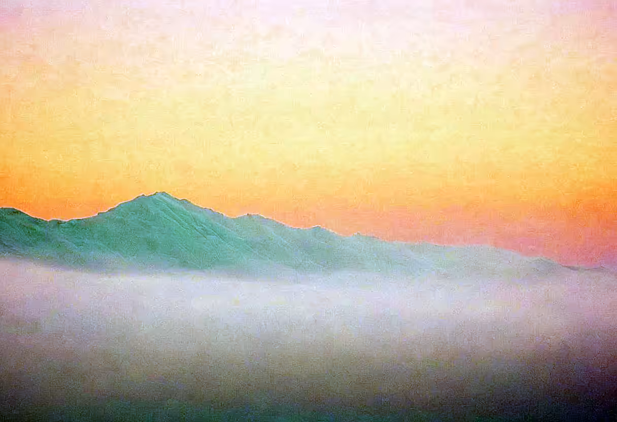 Sunrise Over Misty Mountains