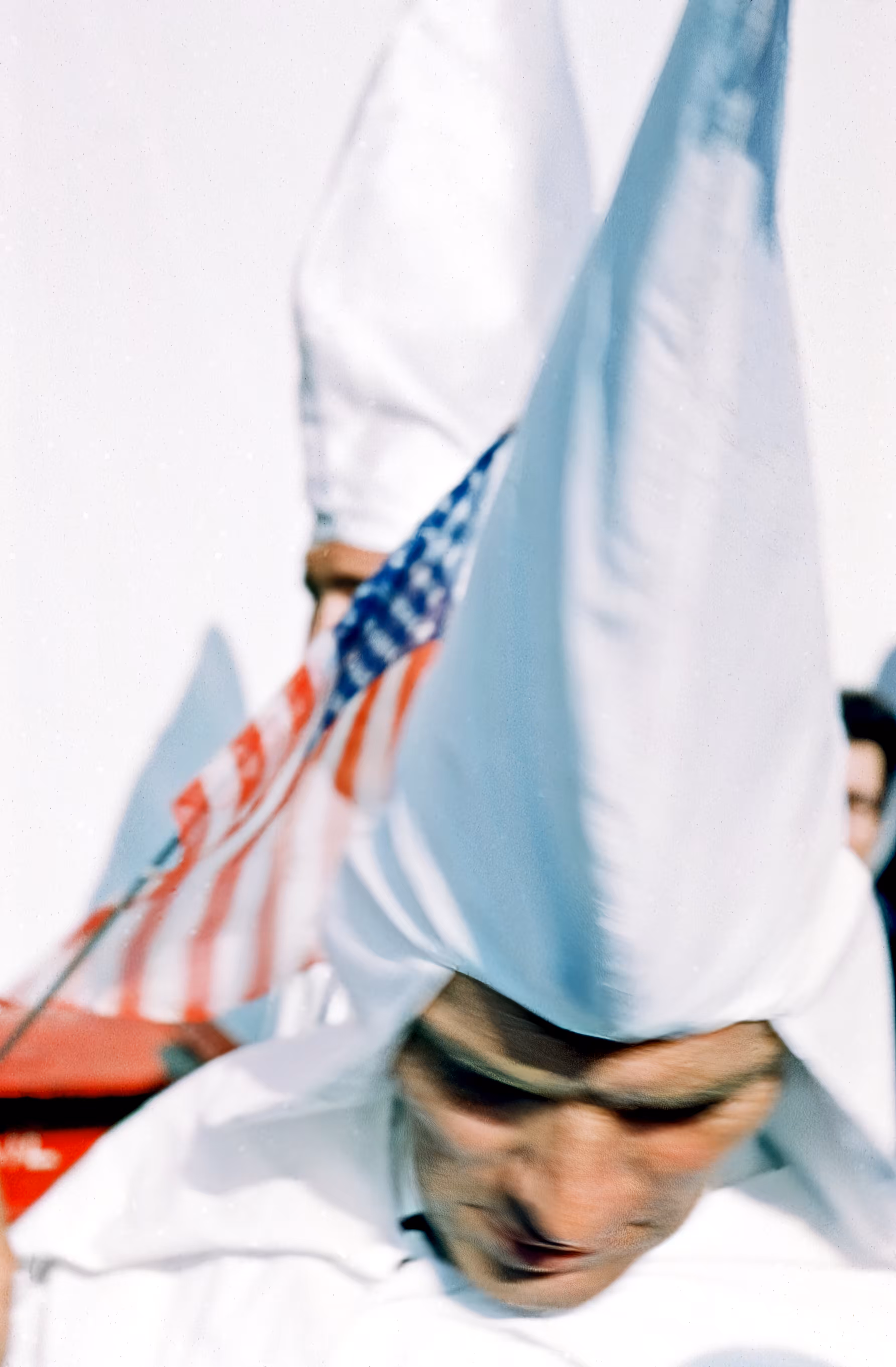 KKK Head bowed