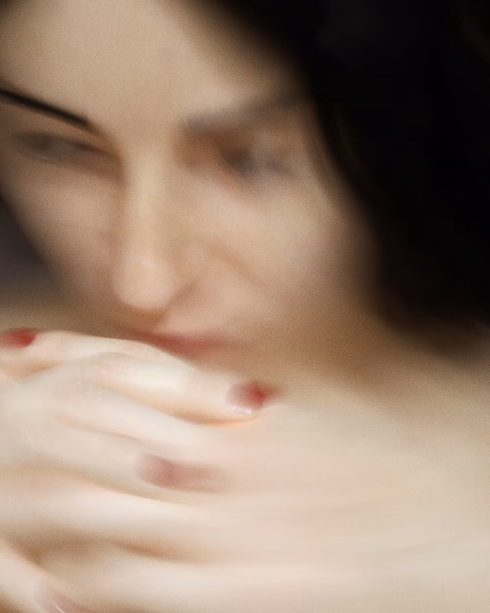 Young woman deep in thought in the hotel room