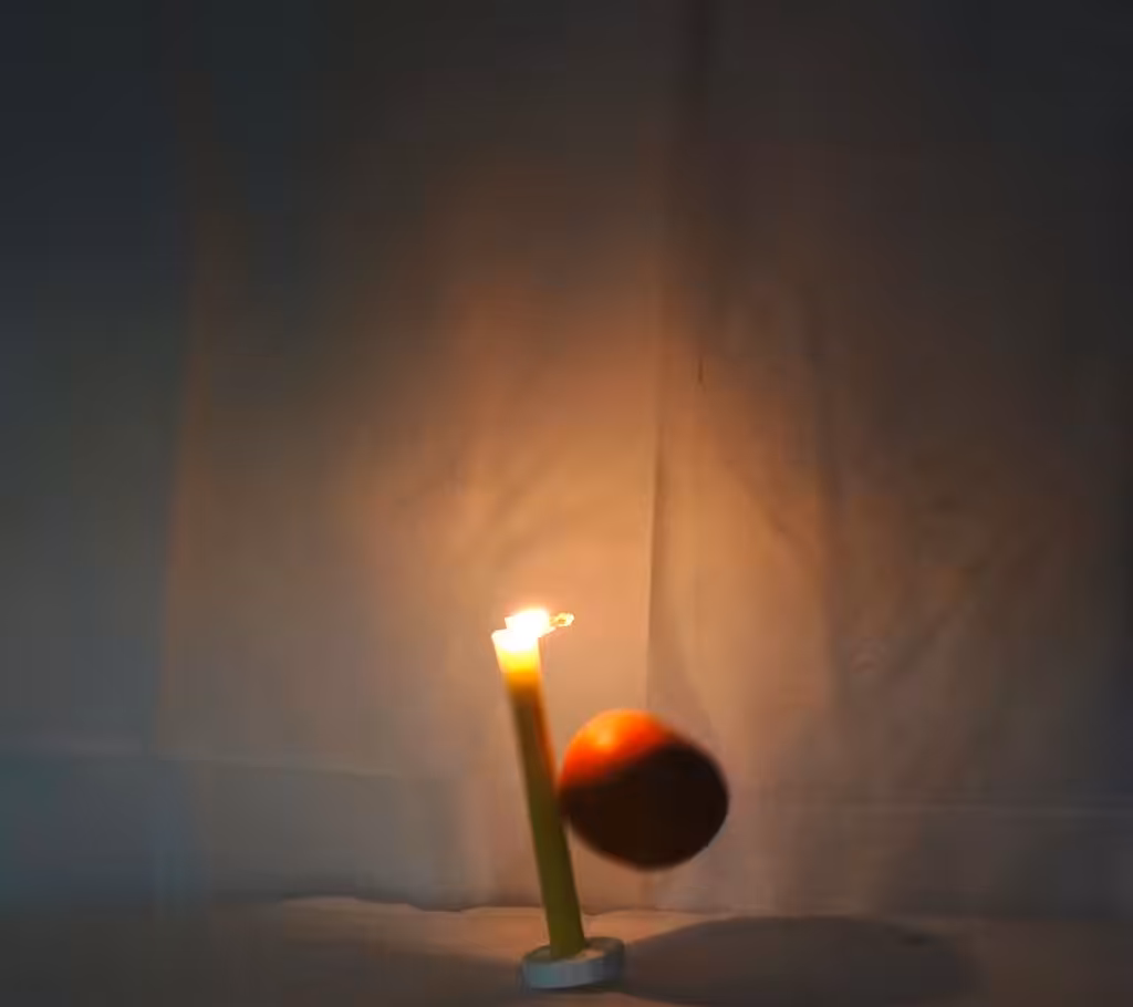 the grapefruit falls on the candle