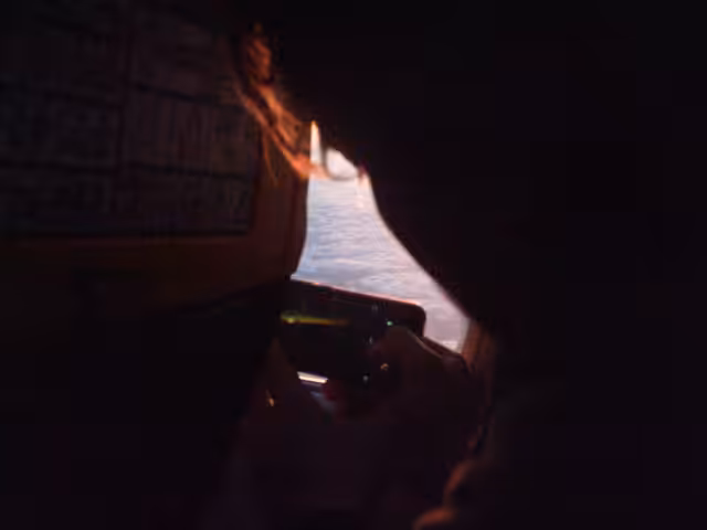Kiss, Interrupted to Take a Sunrise Picture from the Airplane Window
