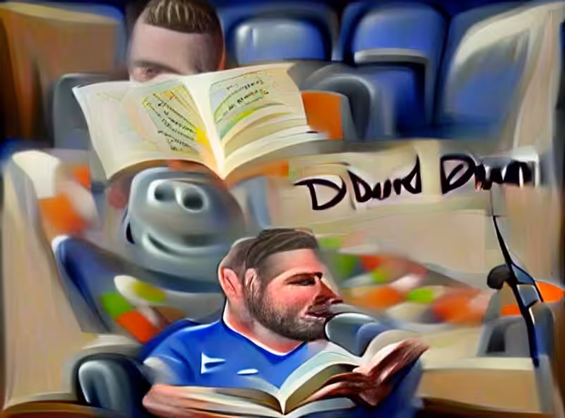 David Dunn reading a book