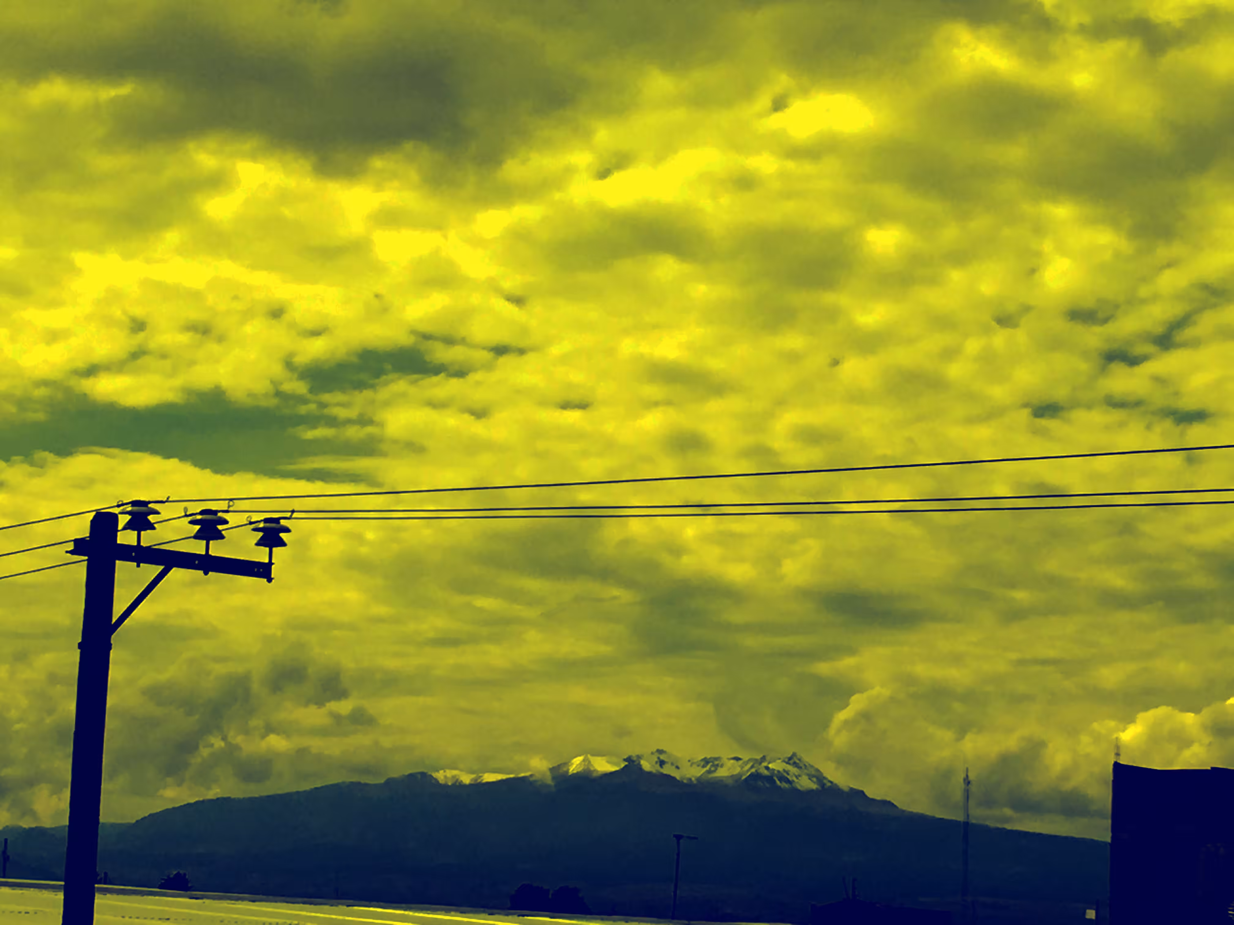 Yellow sky, volcano snow 
