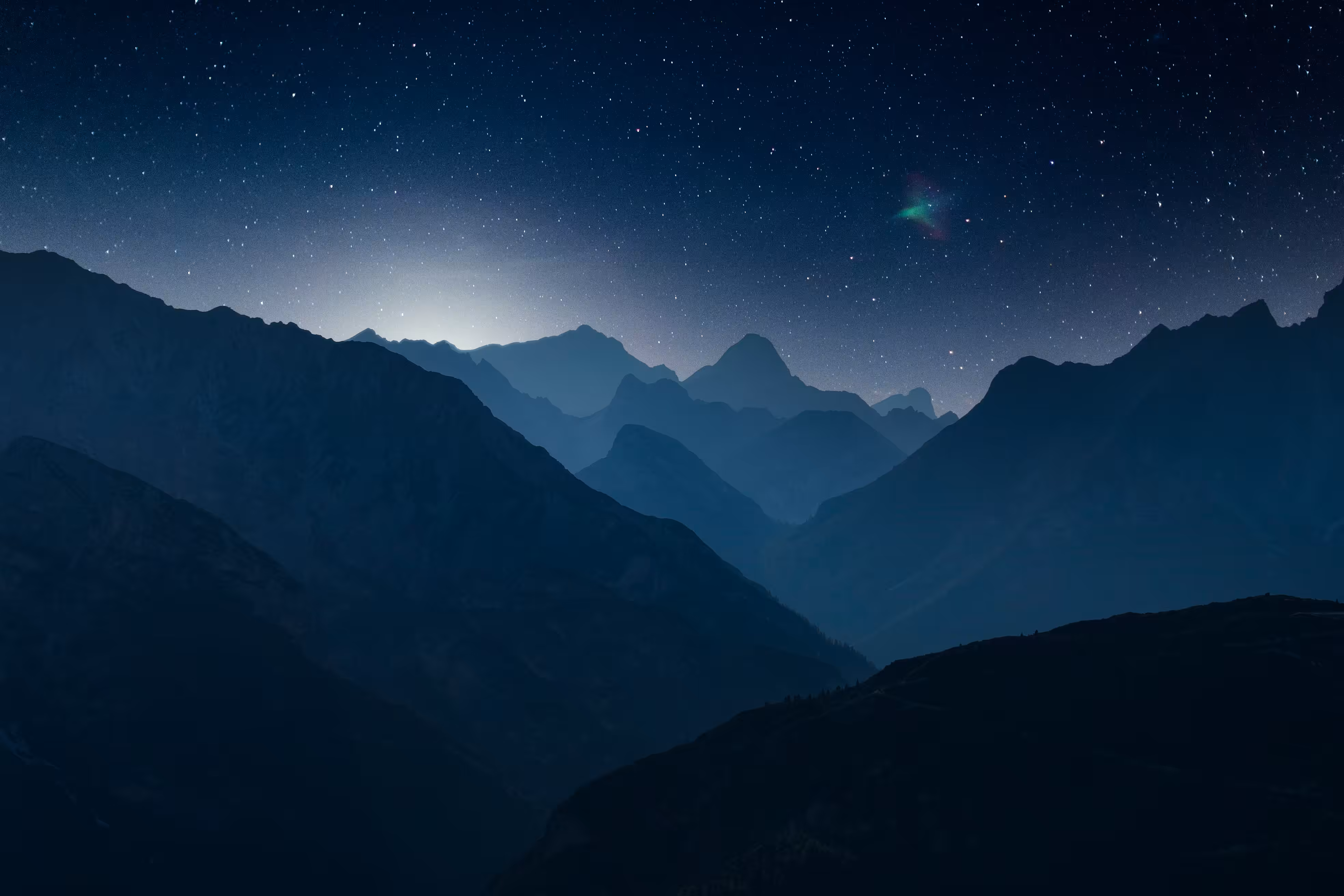 Starry night over mountains.