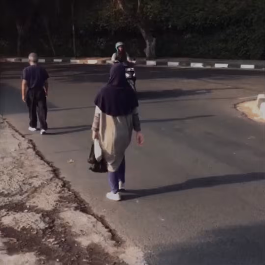 BEHIND YOU