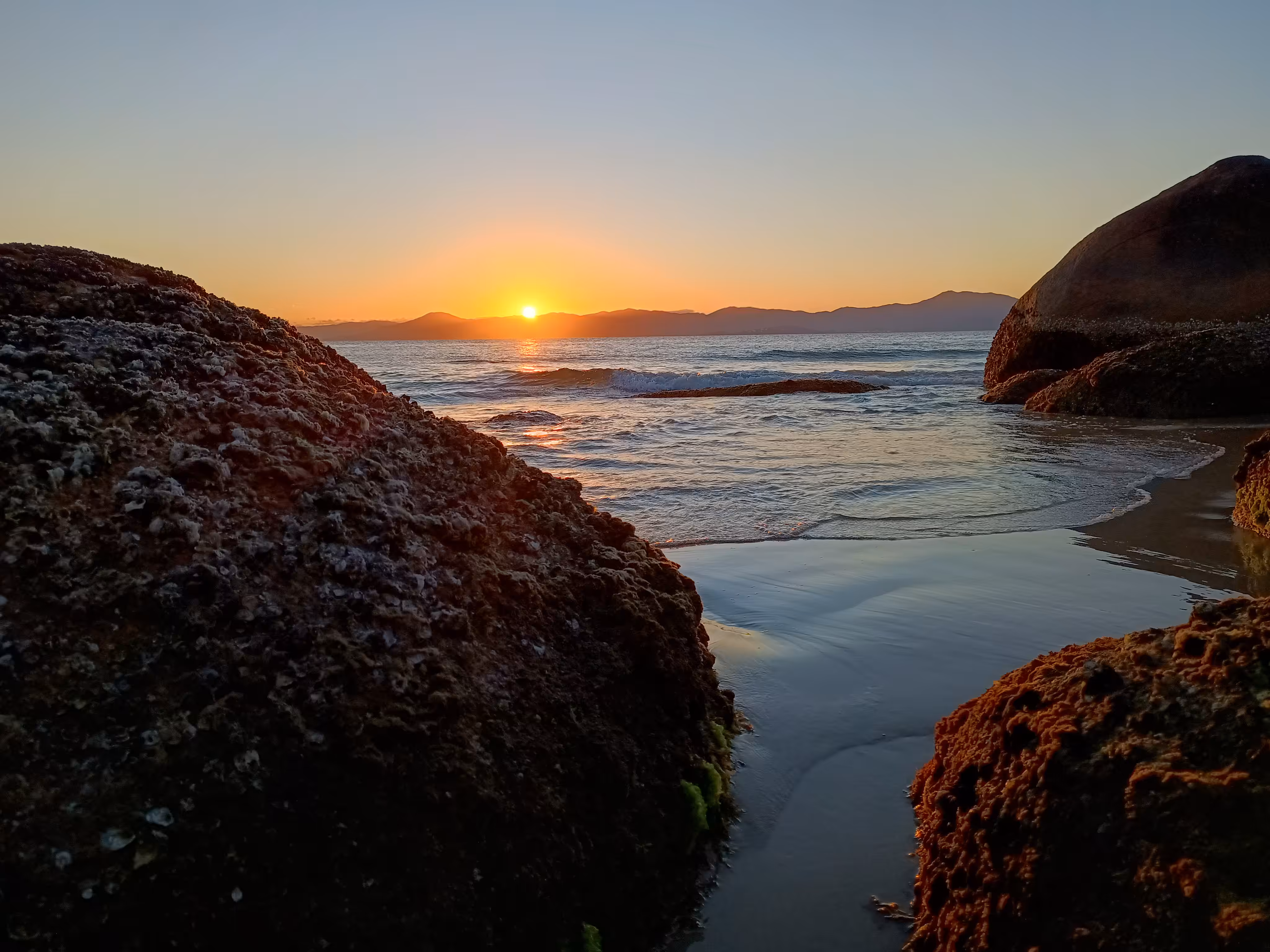 Sunset between rocks