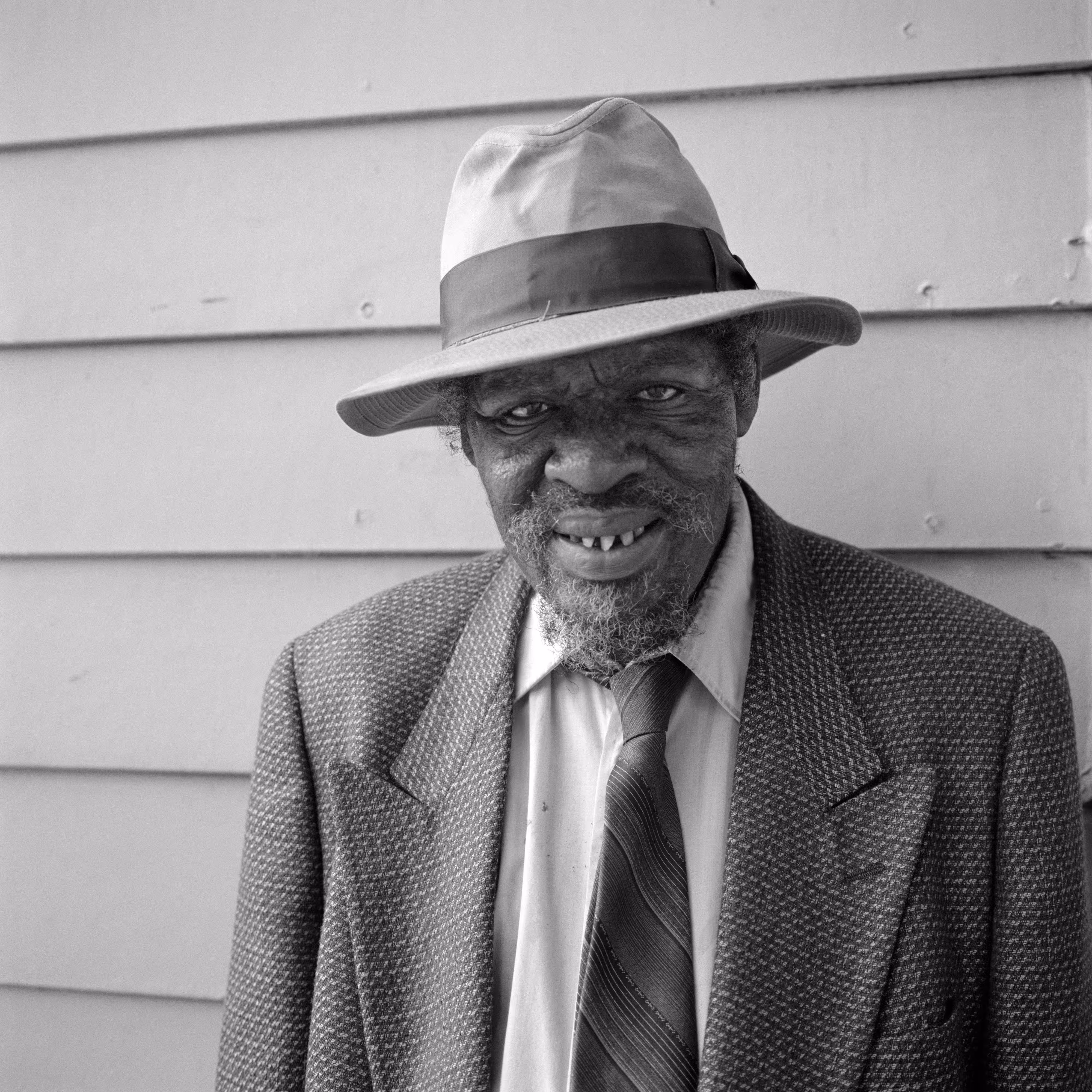 THE VILLAGE #38 PORTRAIT OF A MAN IN A FEDORA by Deanna Templeton