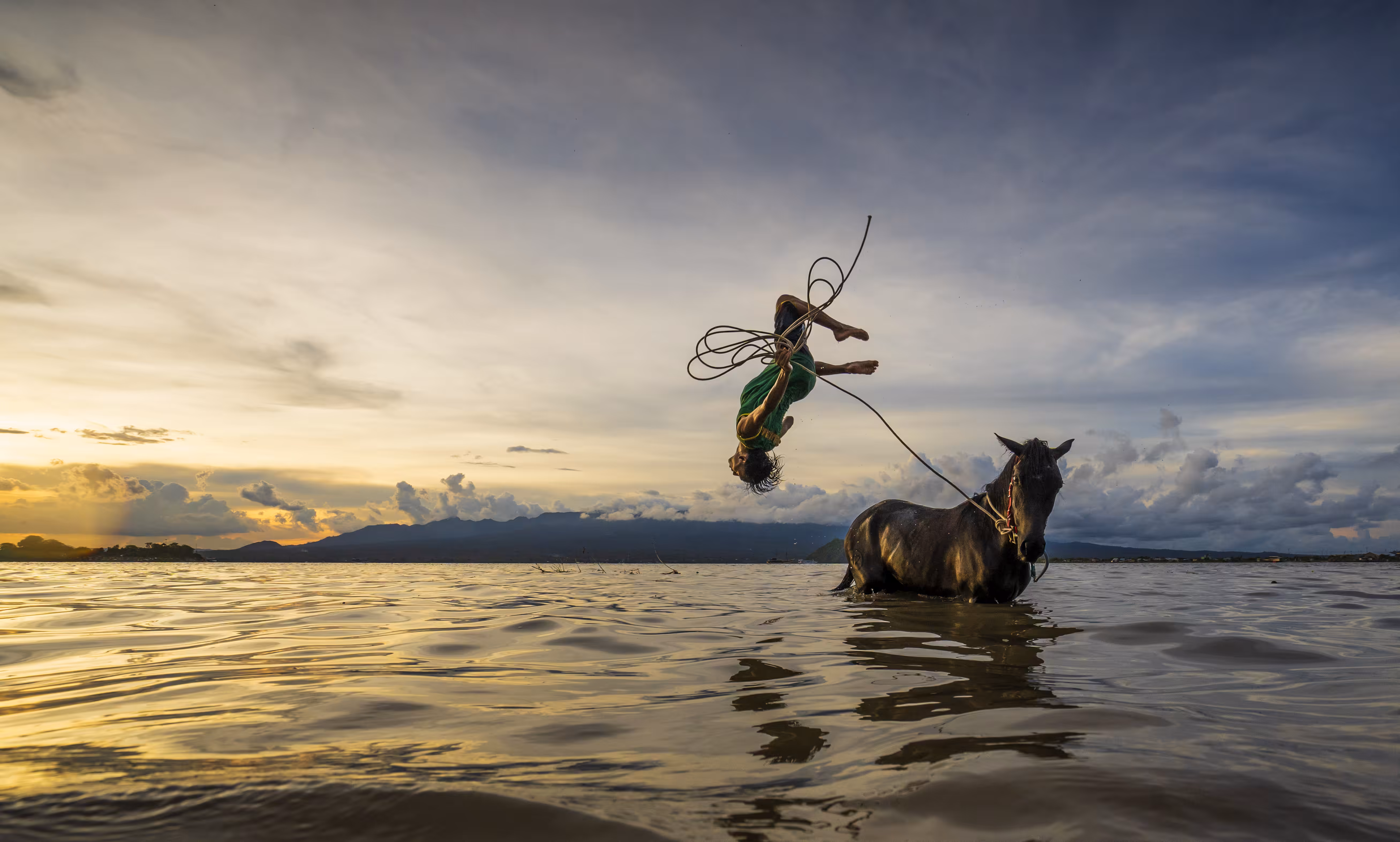 jumping on a horse