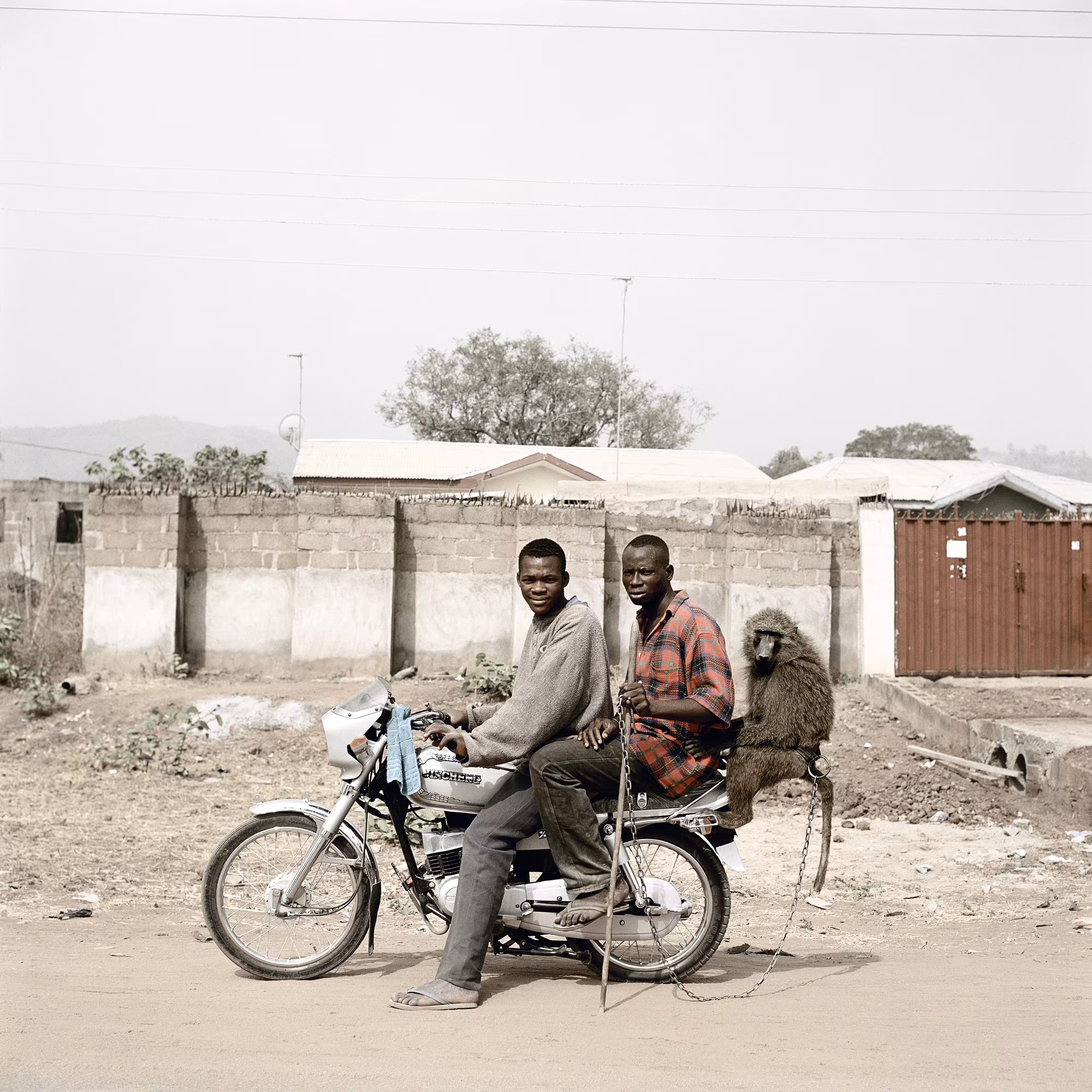 Nura Garuba and friend with their monkey, Abuja, Nigeria, 2005