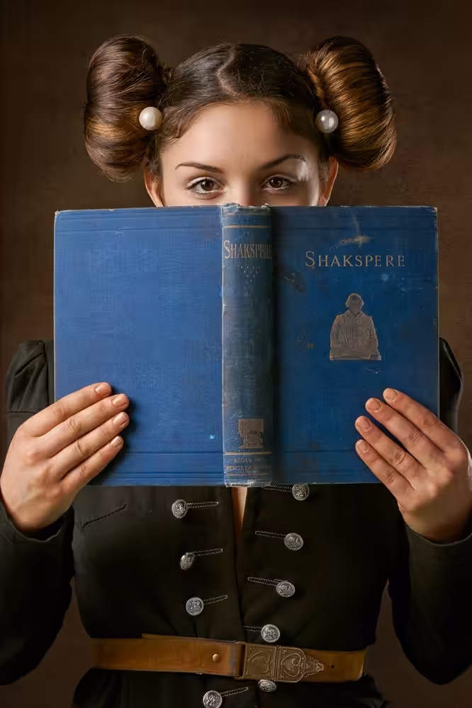 Girl Smiling Behind a Book