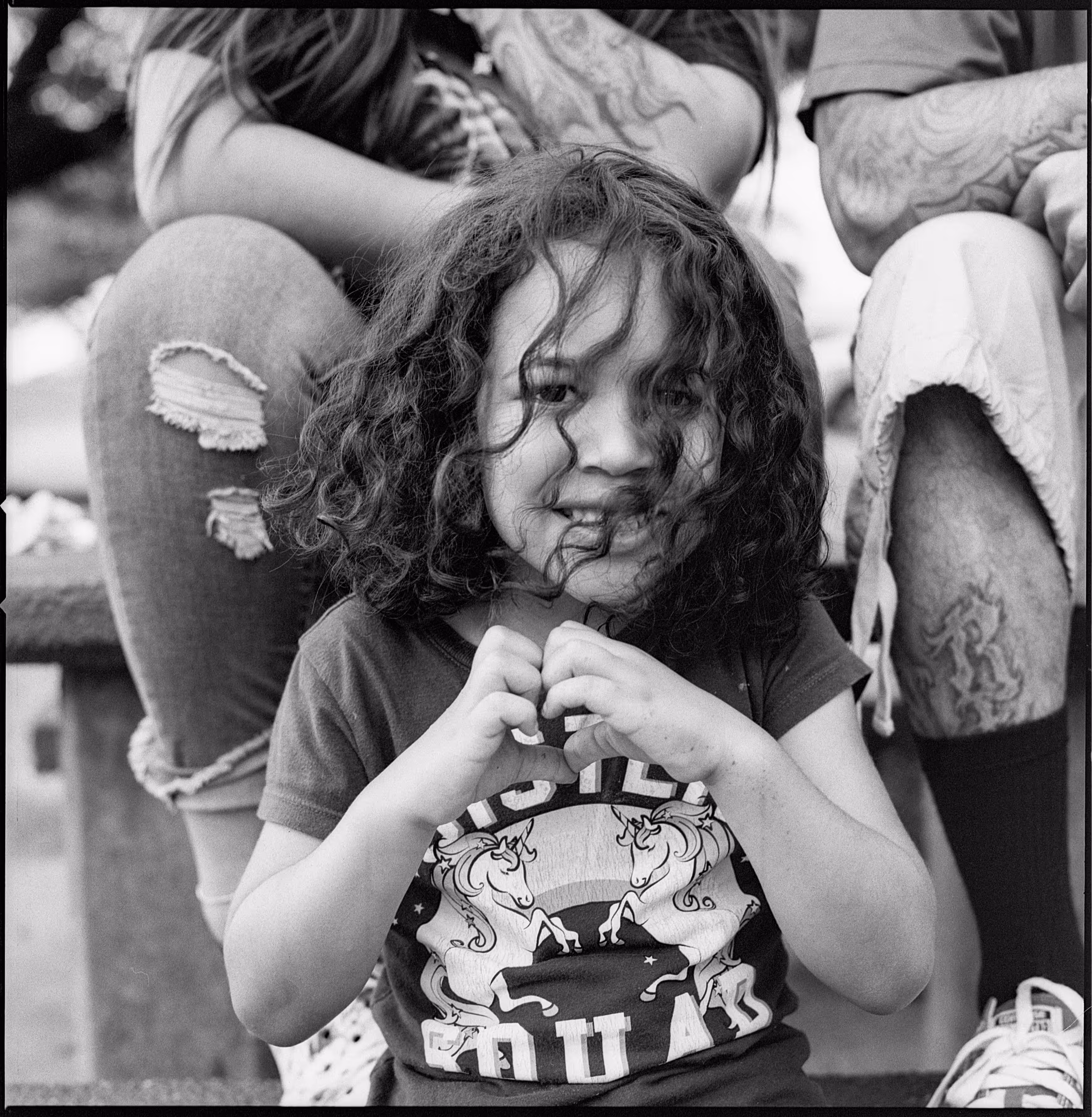 A young girl with her parents.
