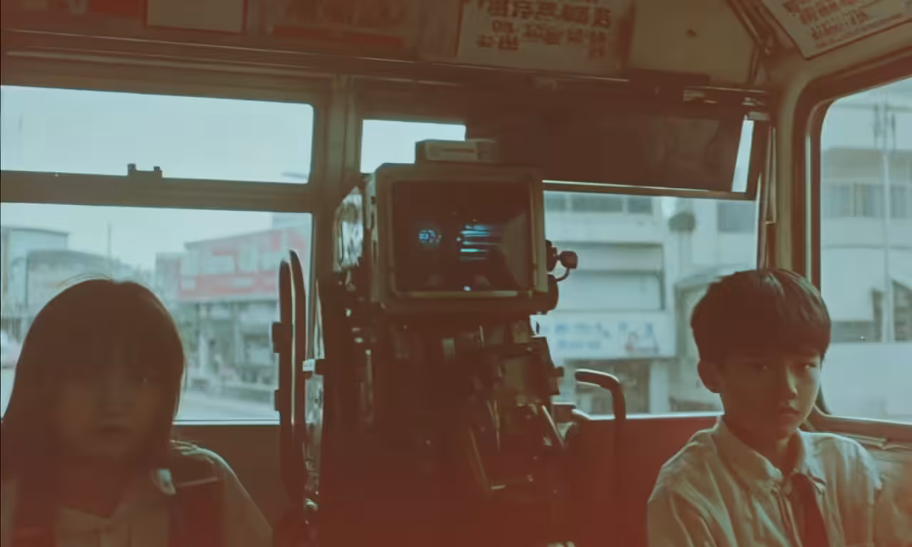 Sitting at the back of the bus.