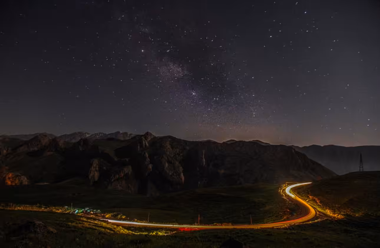 Milky Way Over a Winding Road