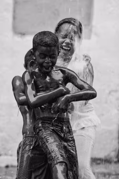 Laughter sculpted with rain.