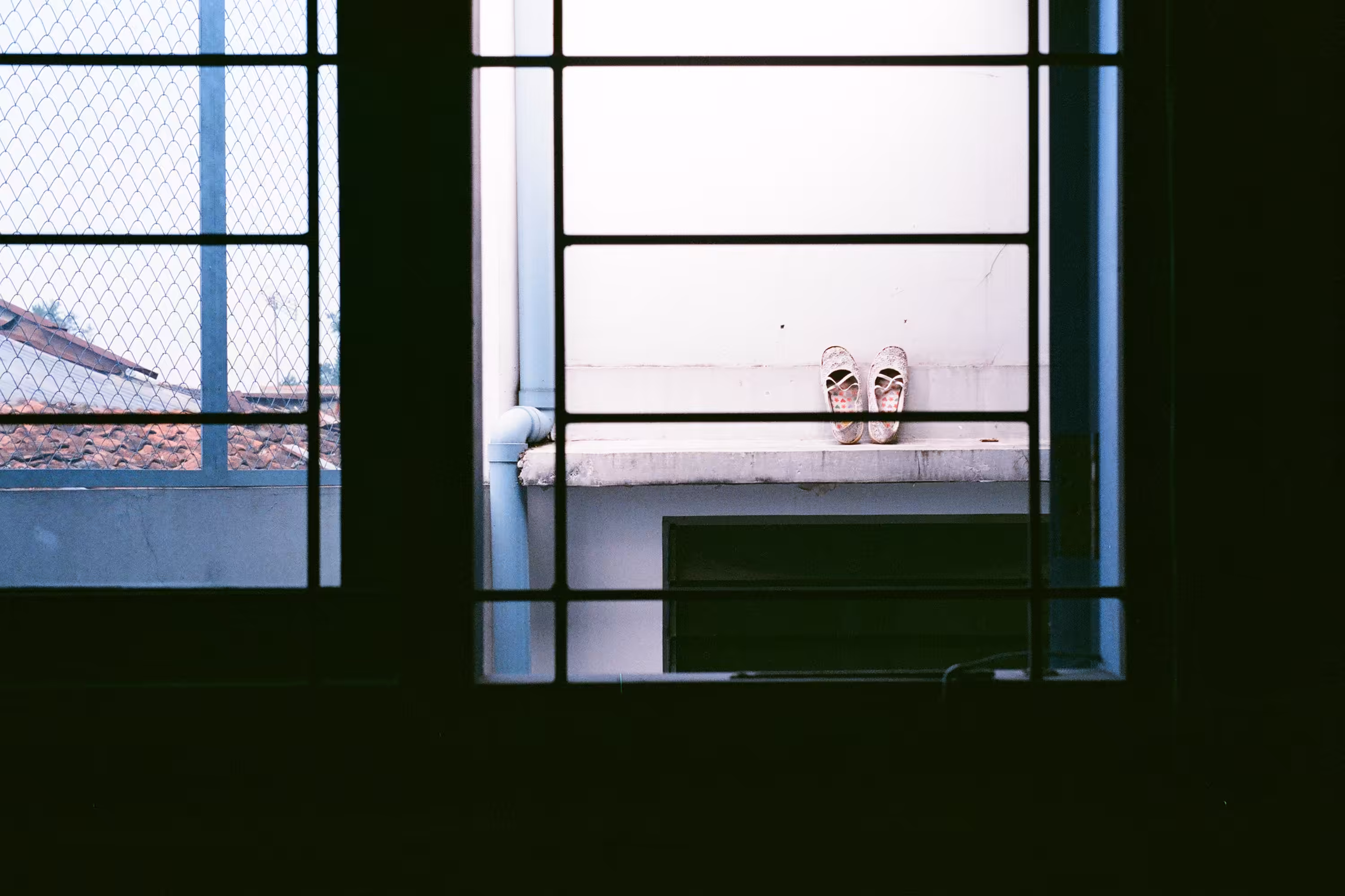 Shoes Outside a Window