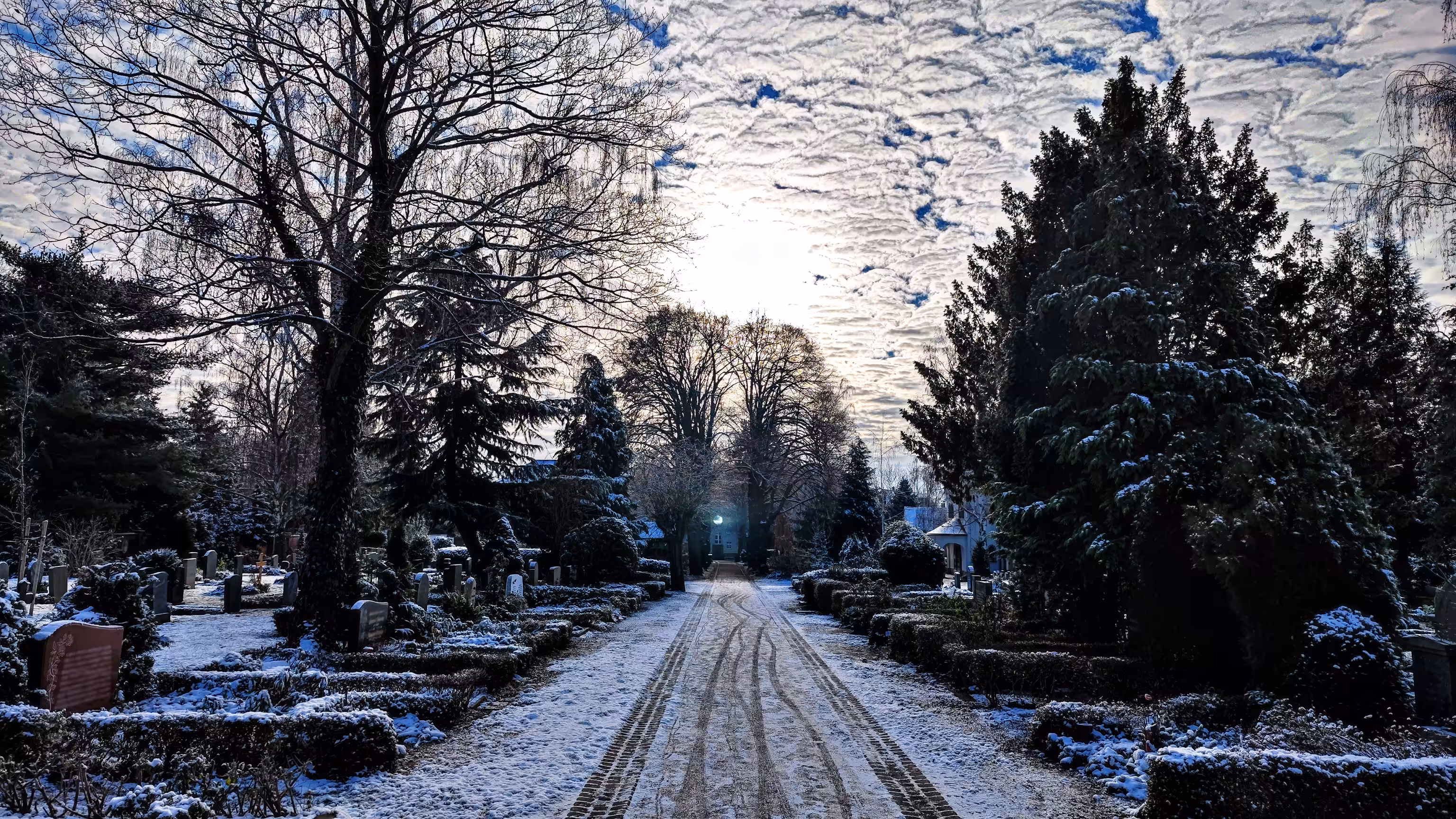 Sun behind snow-white clouds