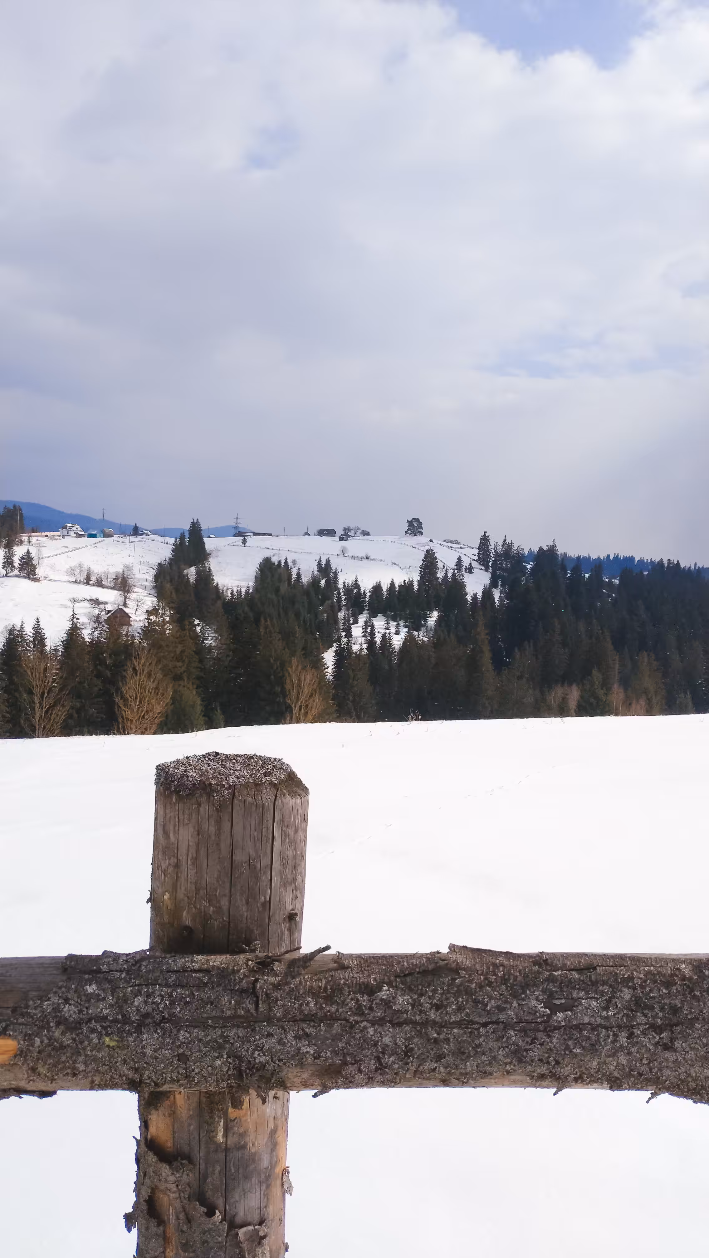 Carpathian mountains through a fence, Vorohta, Ukraine.