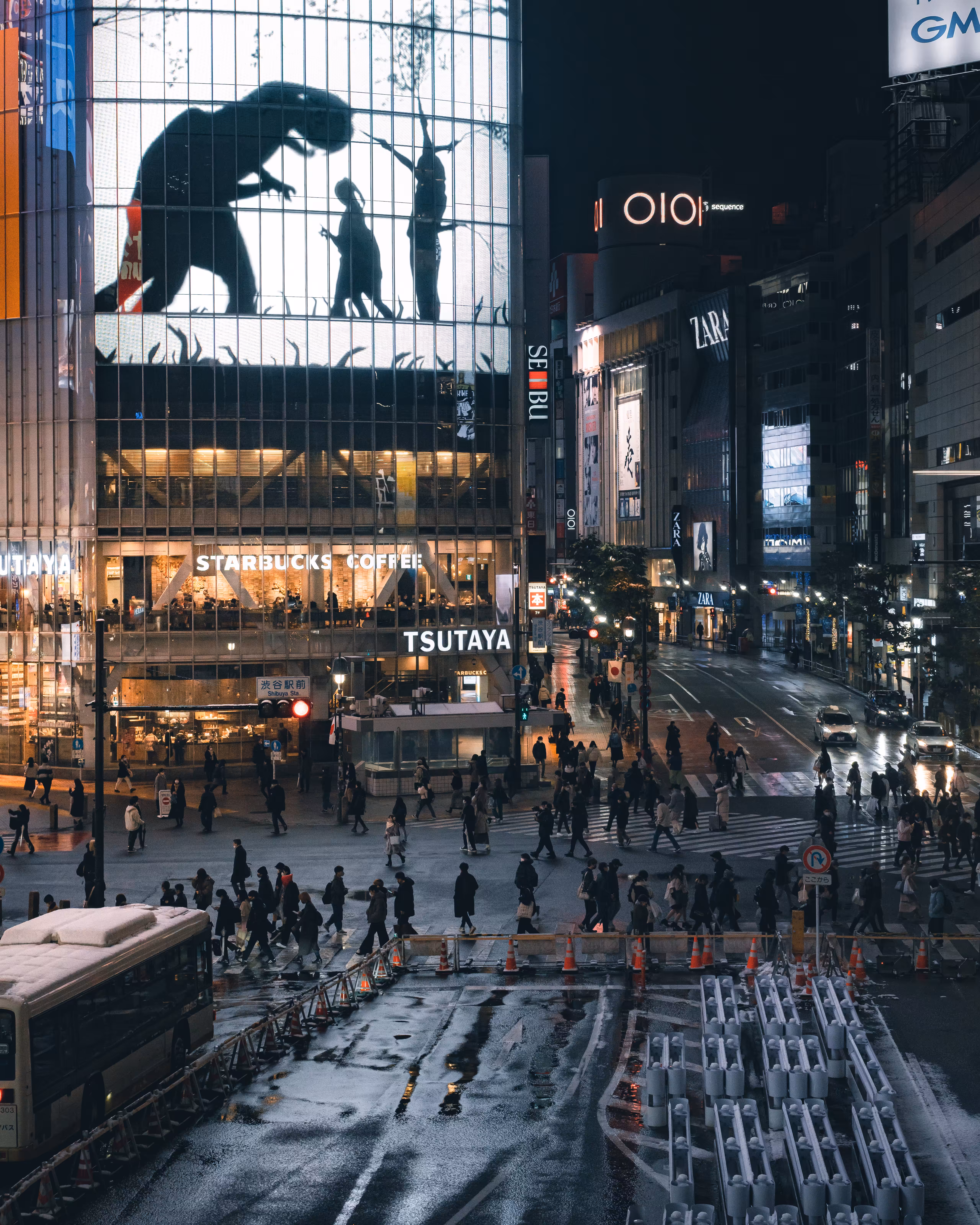 A snowy urban scene and dinosaurs