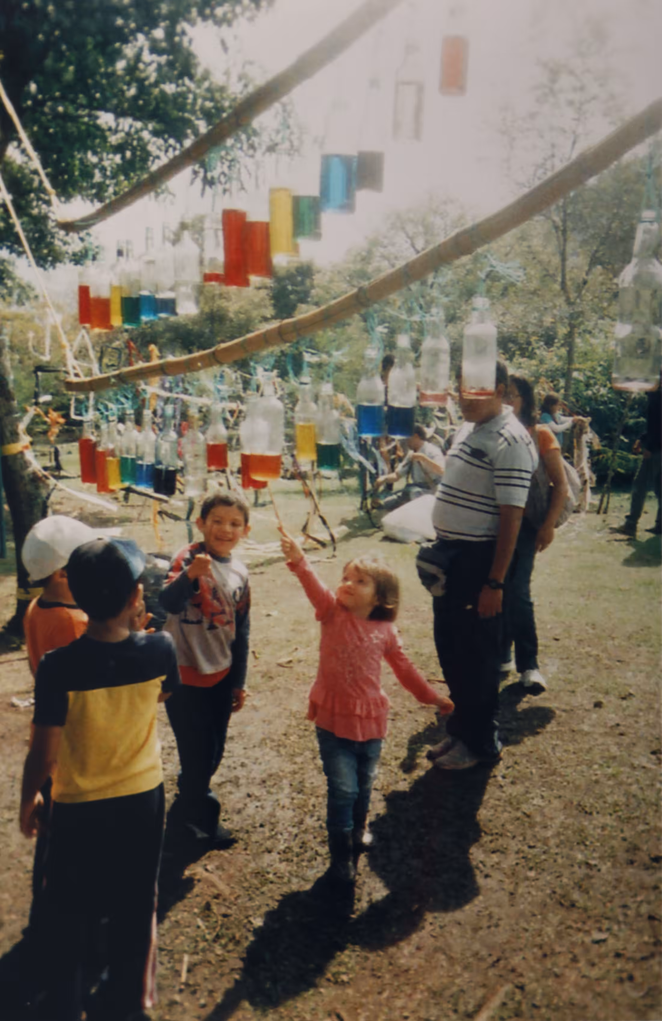 Colored water, lovely sounds and happy kids.