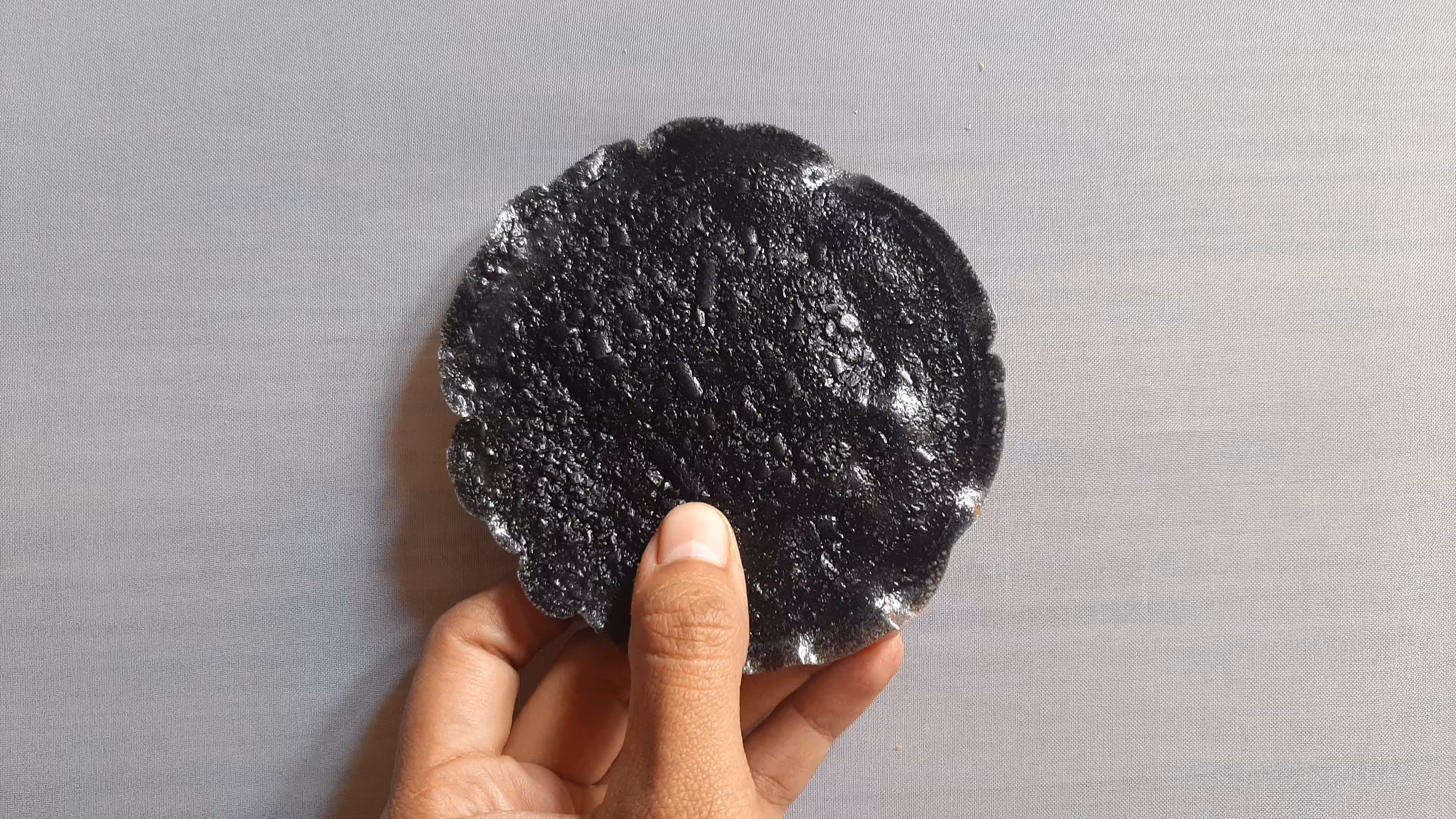 Circular shape, held in my hand, top view