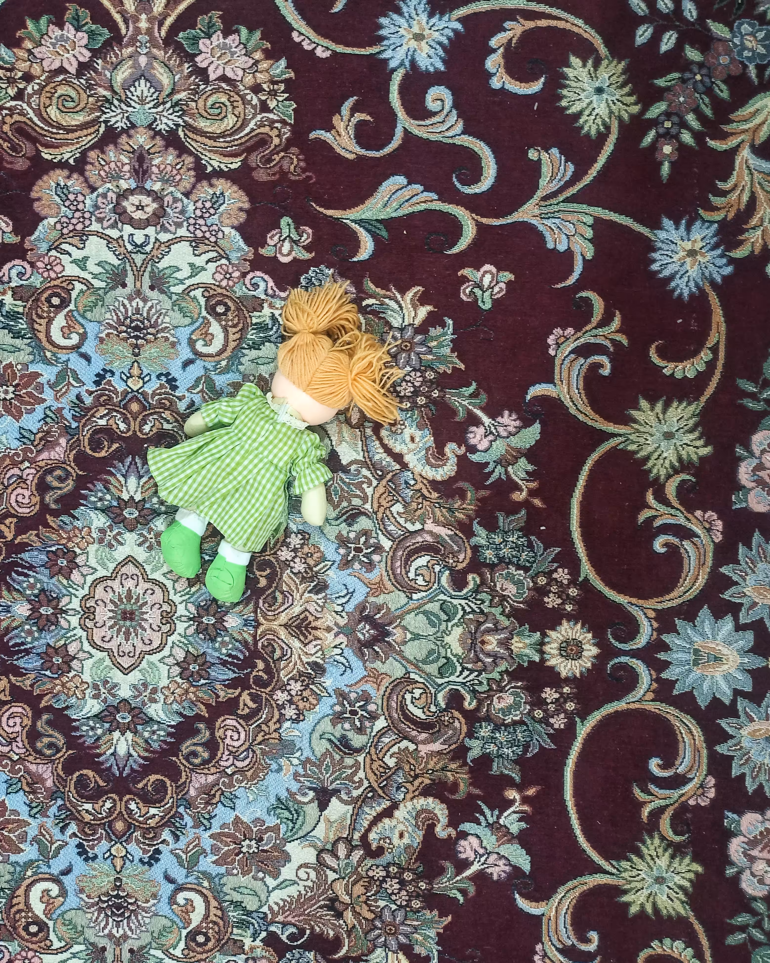 My doll is wearing red (green)