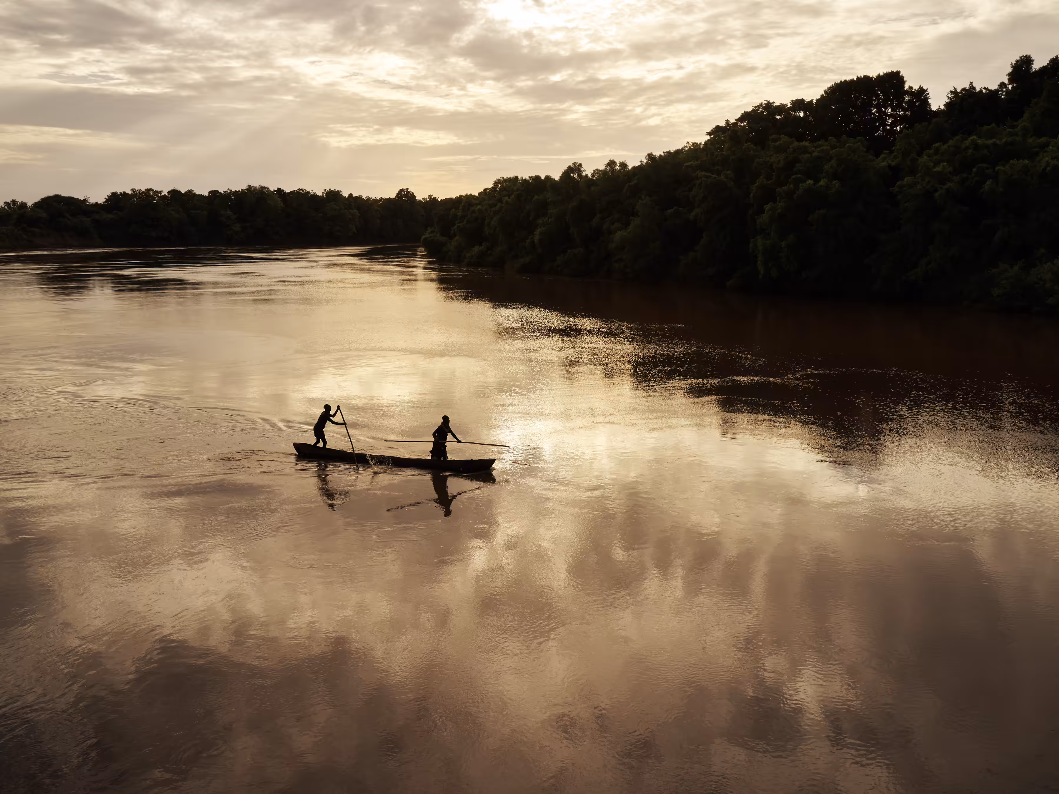Ethiopia - A Dugout Canoe Crosses the Omo River