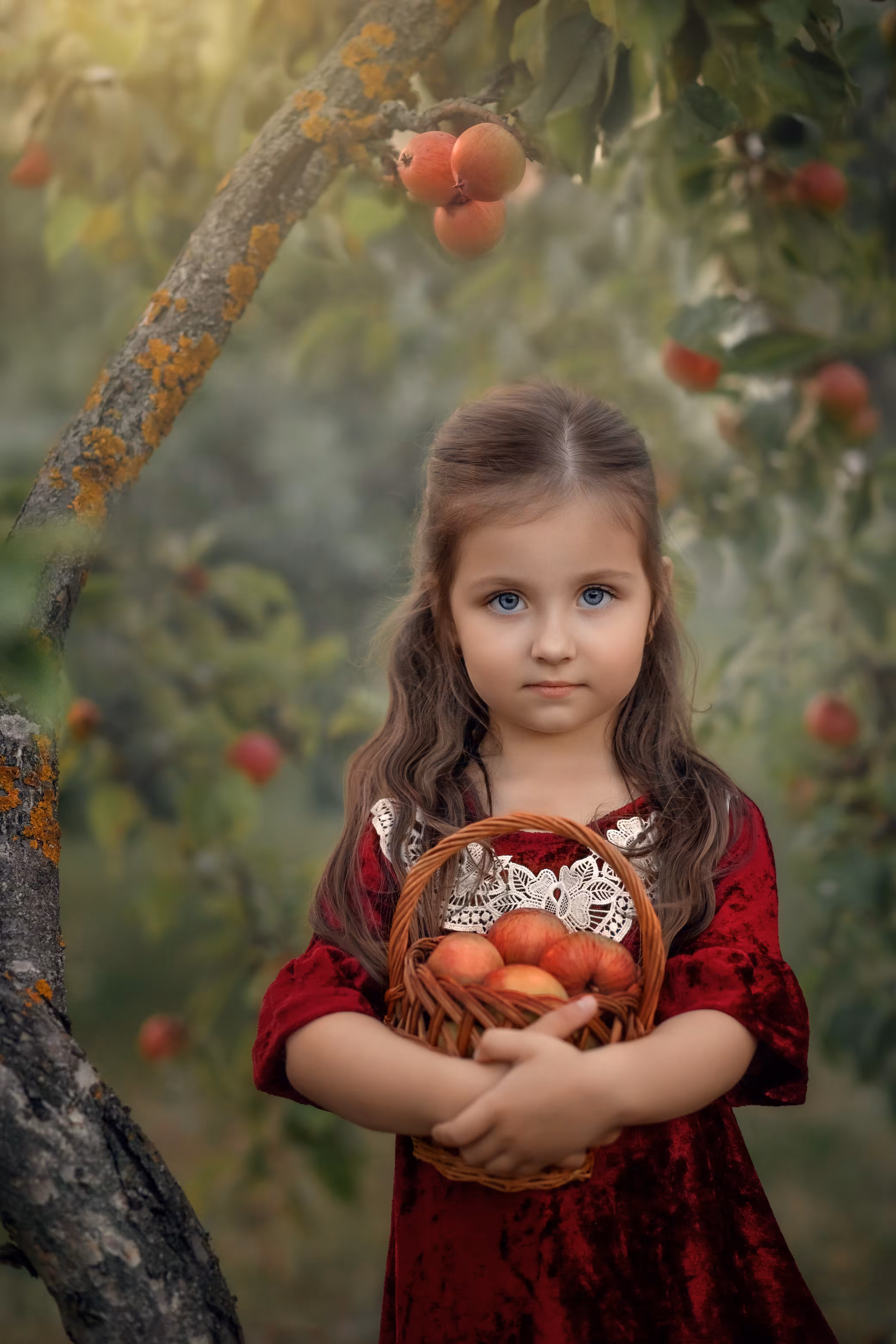 Girl with a basket of apples