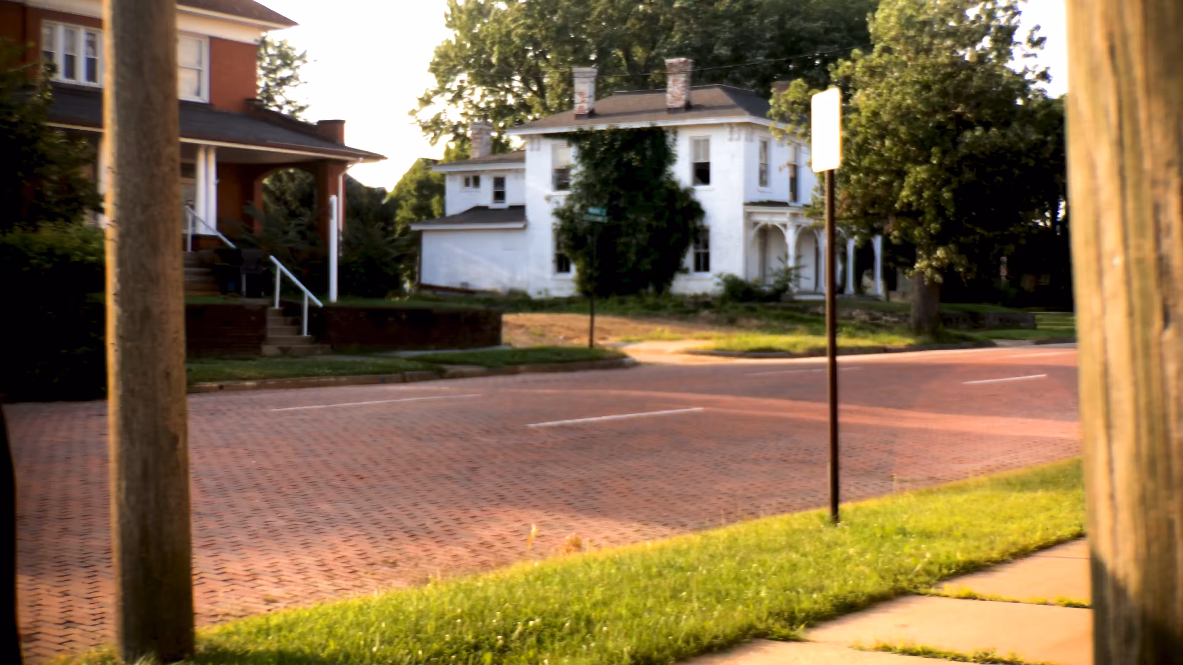 brick road seen from between two poles