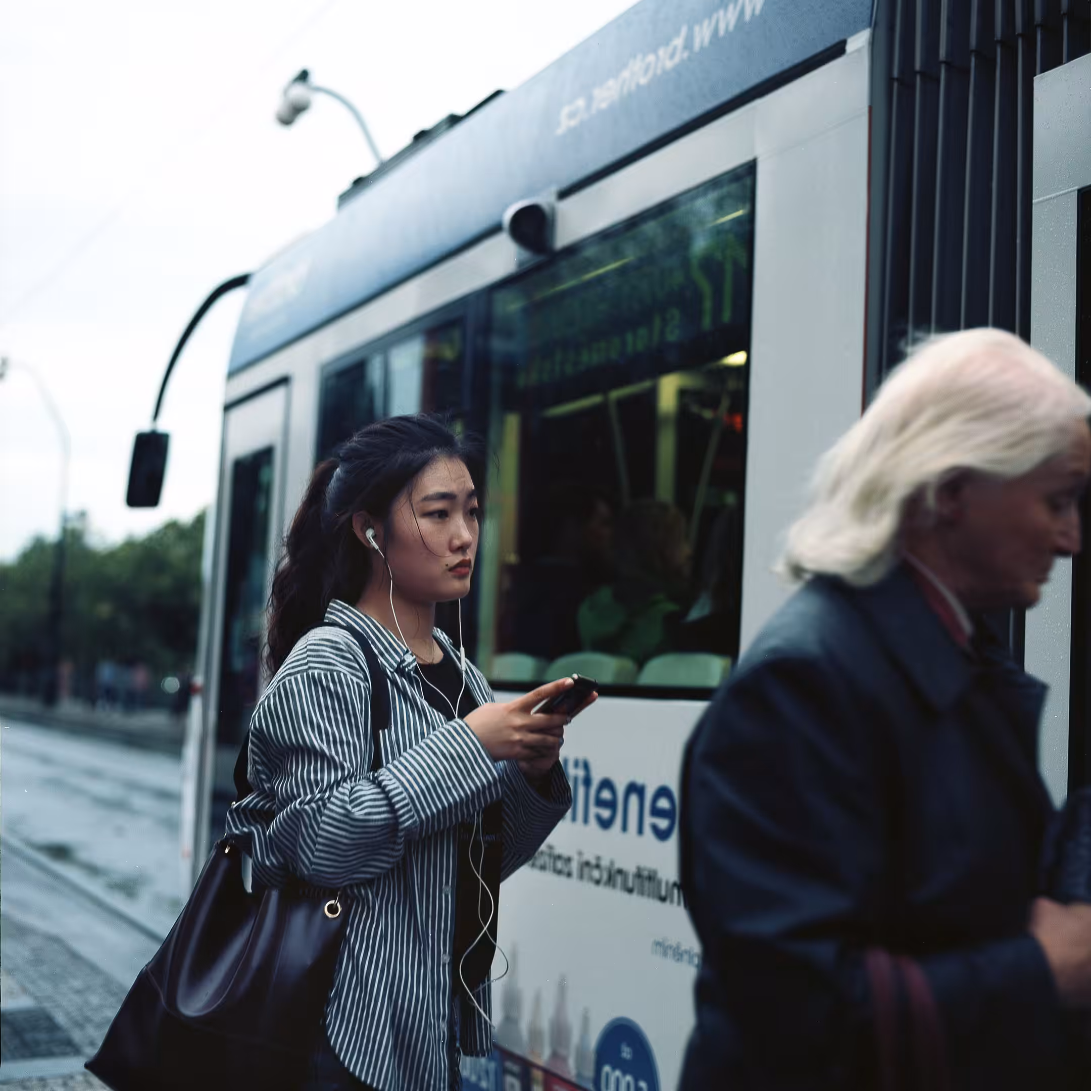 Waiting for her tram