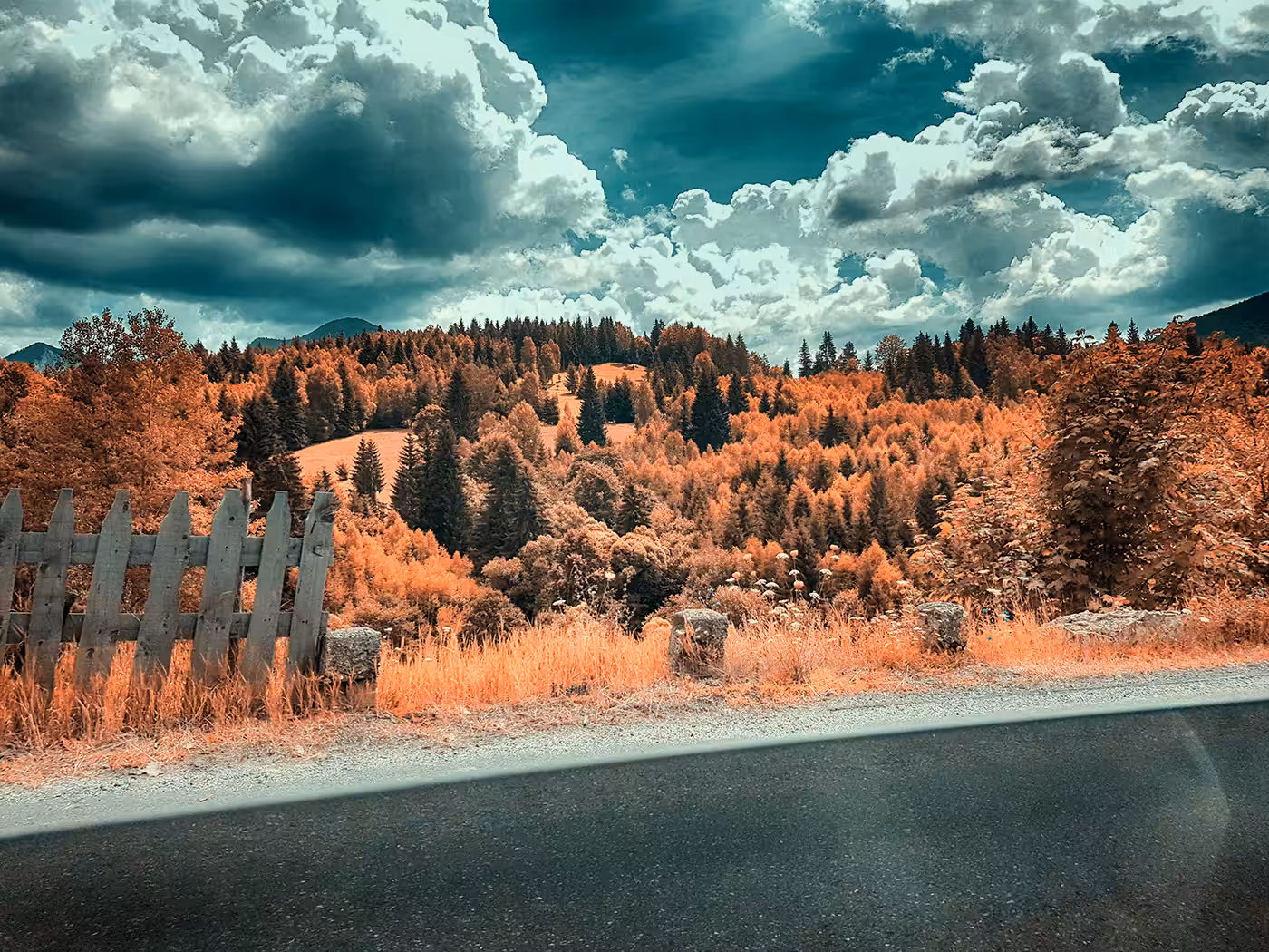 Mountain, Sky, Road and a Touch of Fence