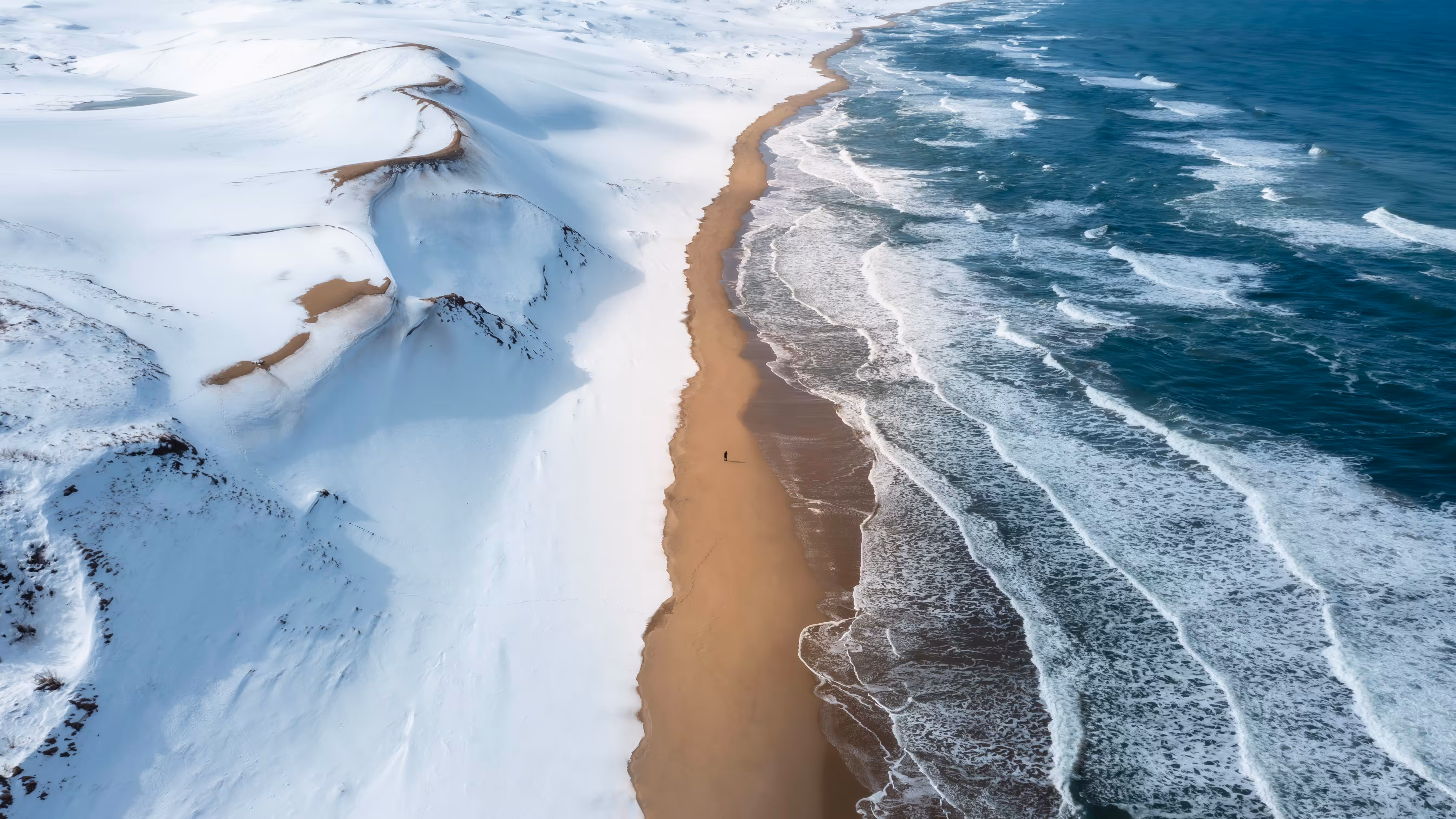 Tranquil Snow Dunes, Raging Ocean Waves