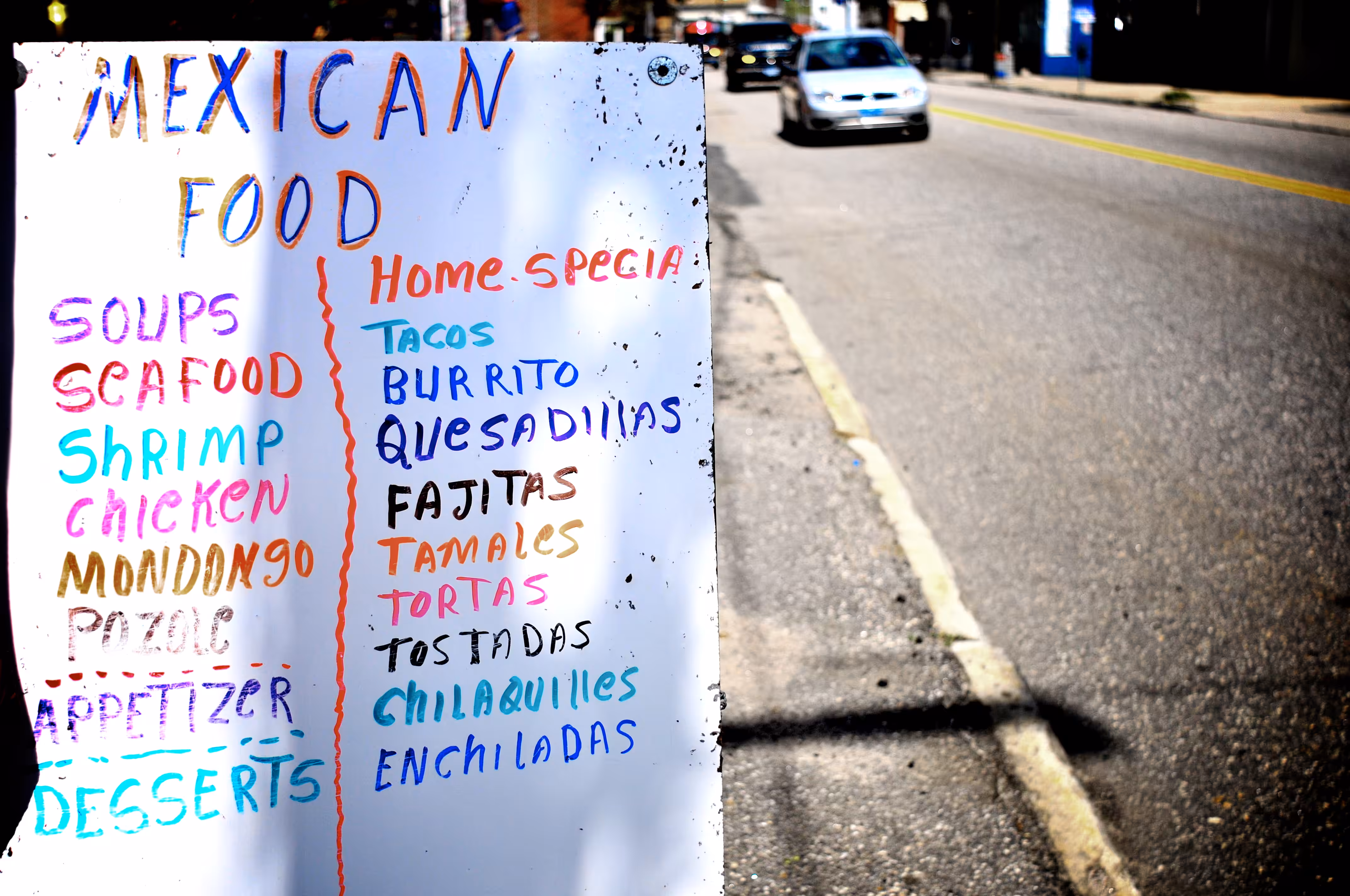 sidewalk menu on a sunny day