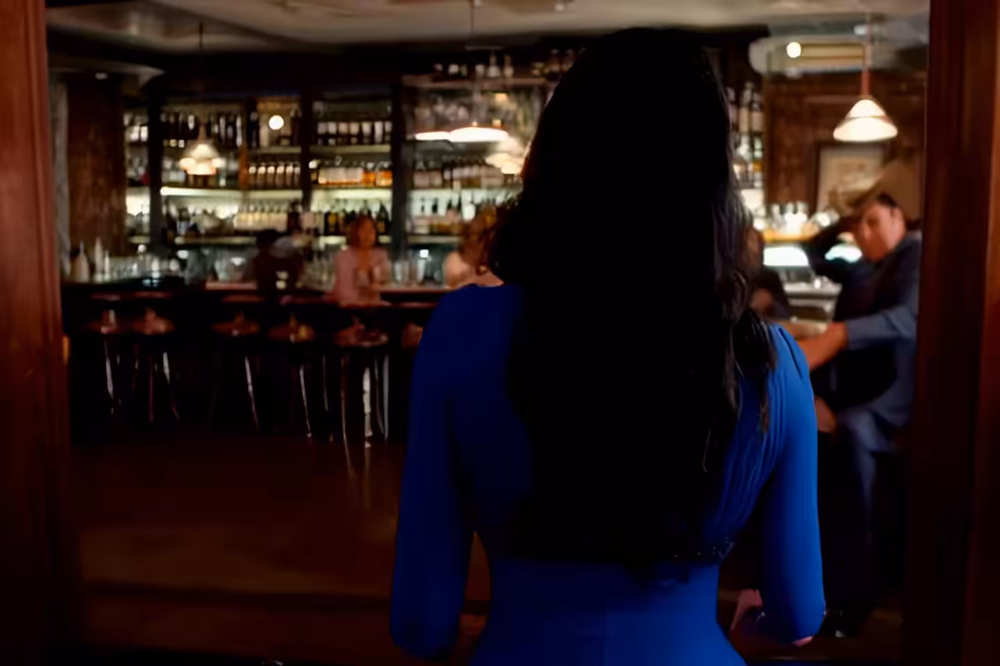 Roope Rainisto - Woman In Blue Dress Fails To Drink Beer At A Busy Bar