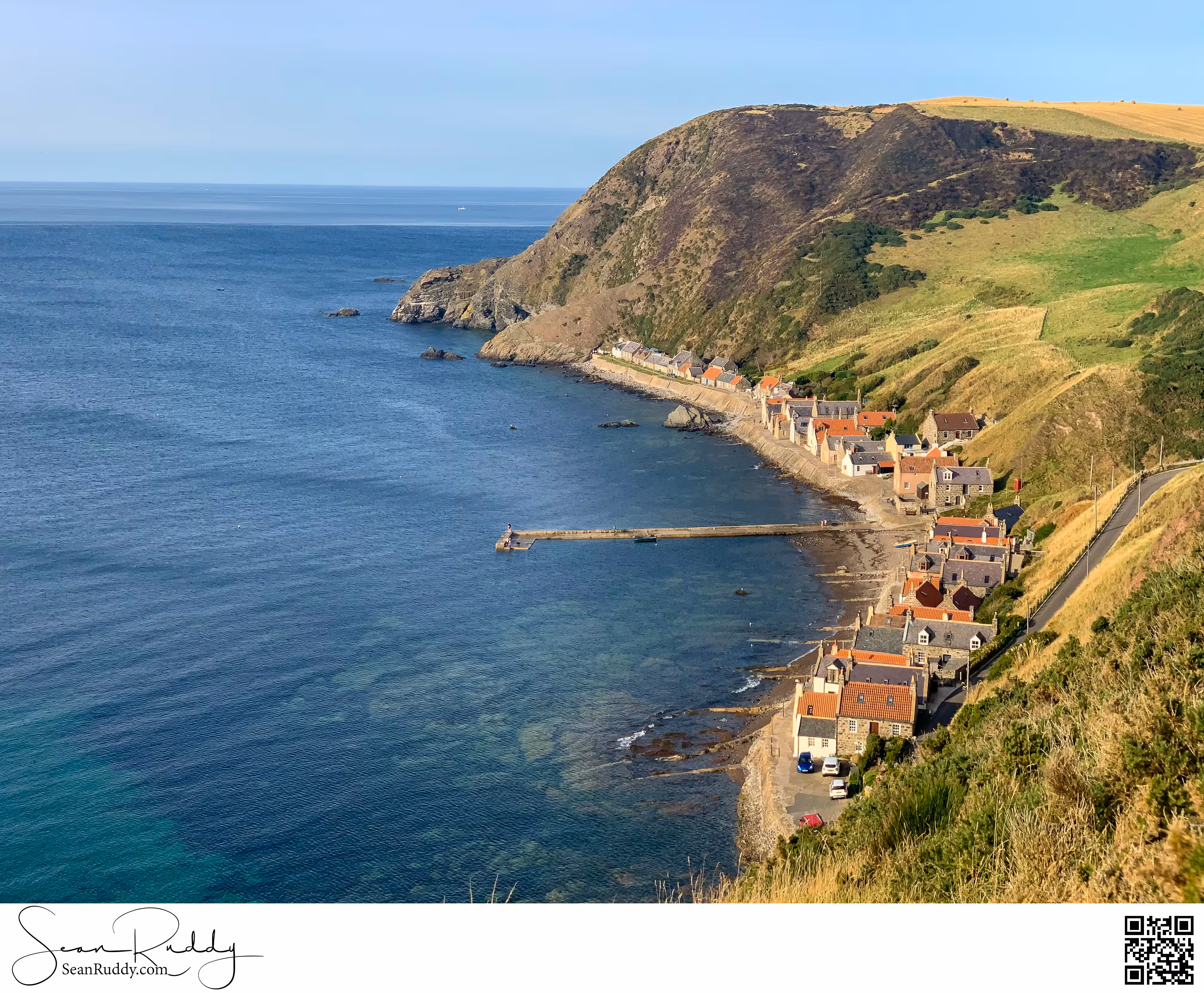 Crovie hugging the cliffs and shore.