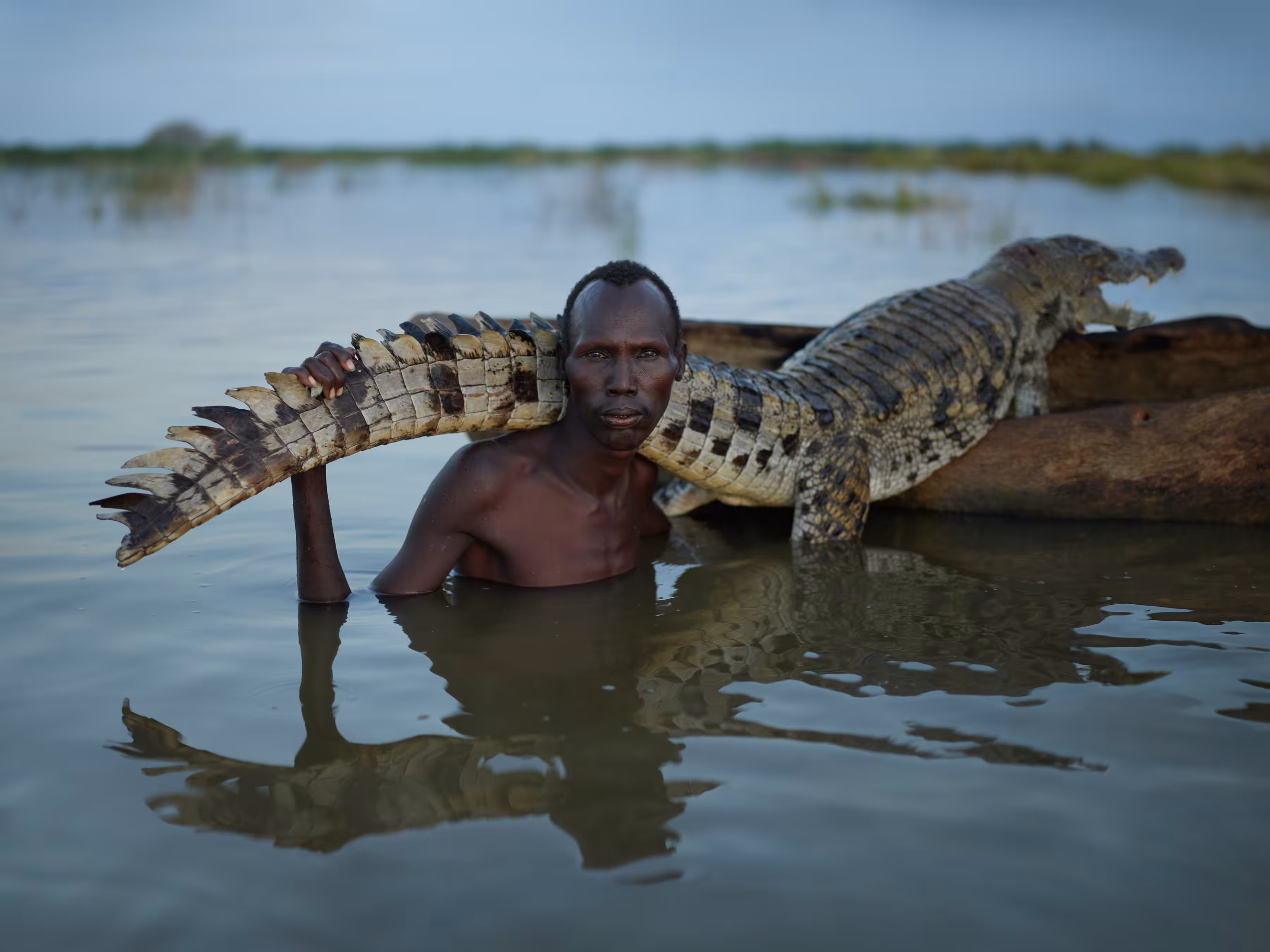 Ethiopia - Mories, a Subsistence Hunter, with Crocodile