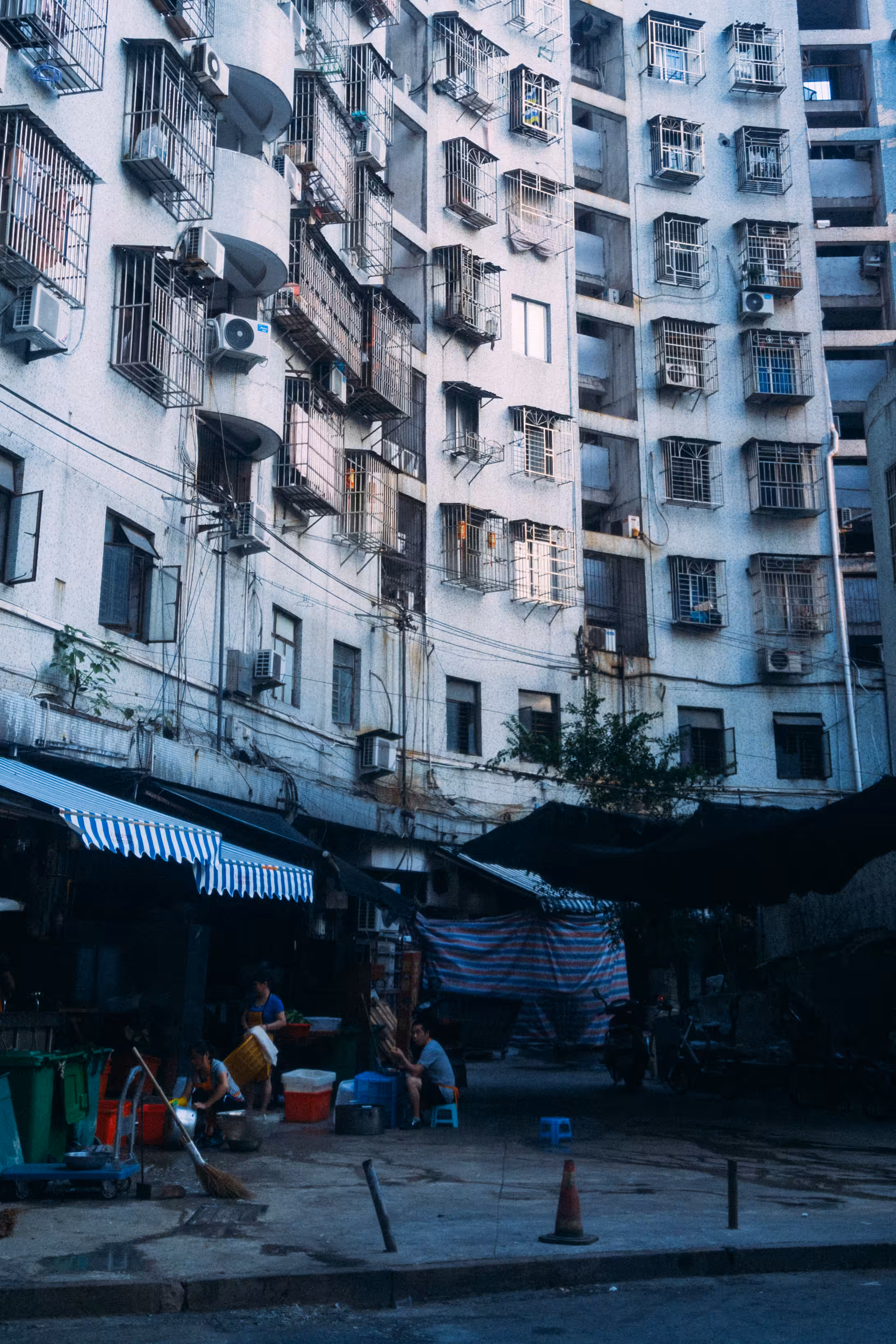 Backyard of a large residential complex with a family preparing food for their restaurant