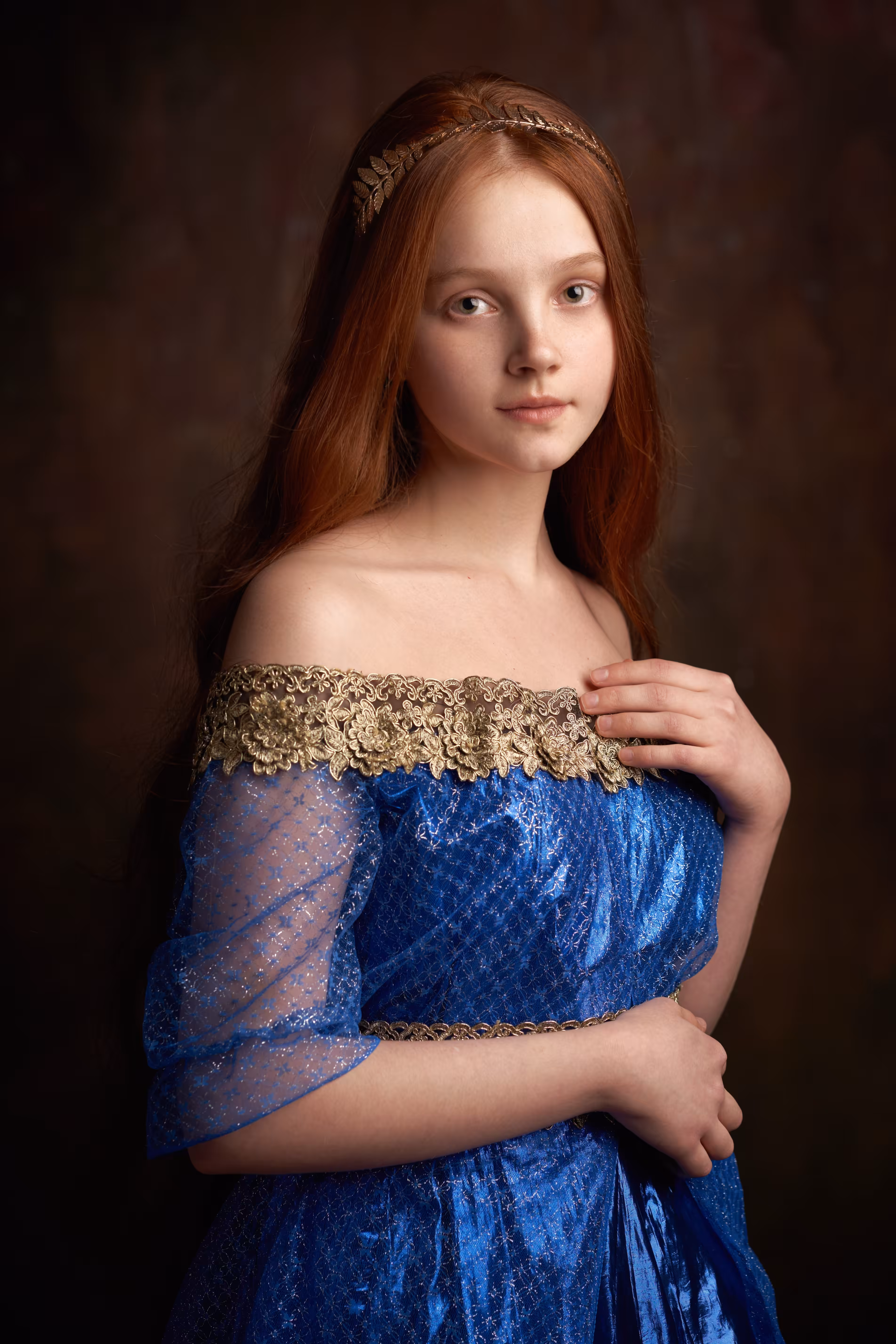 Portrait of a girl in a blue dress