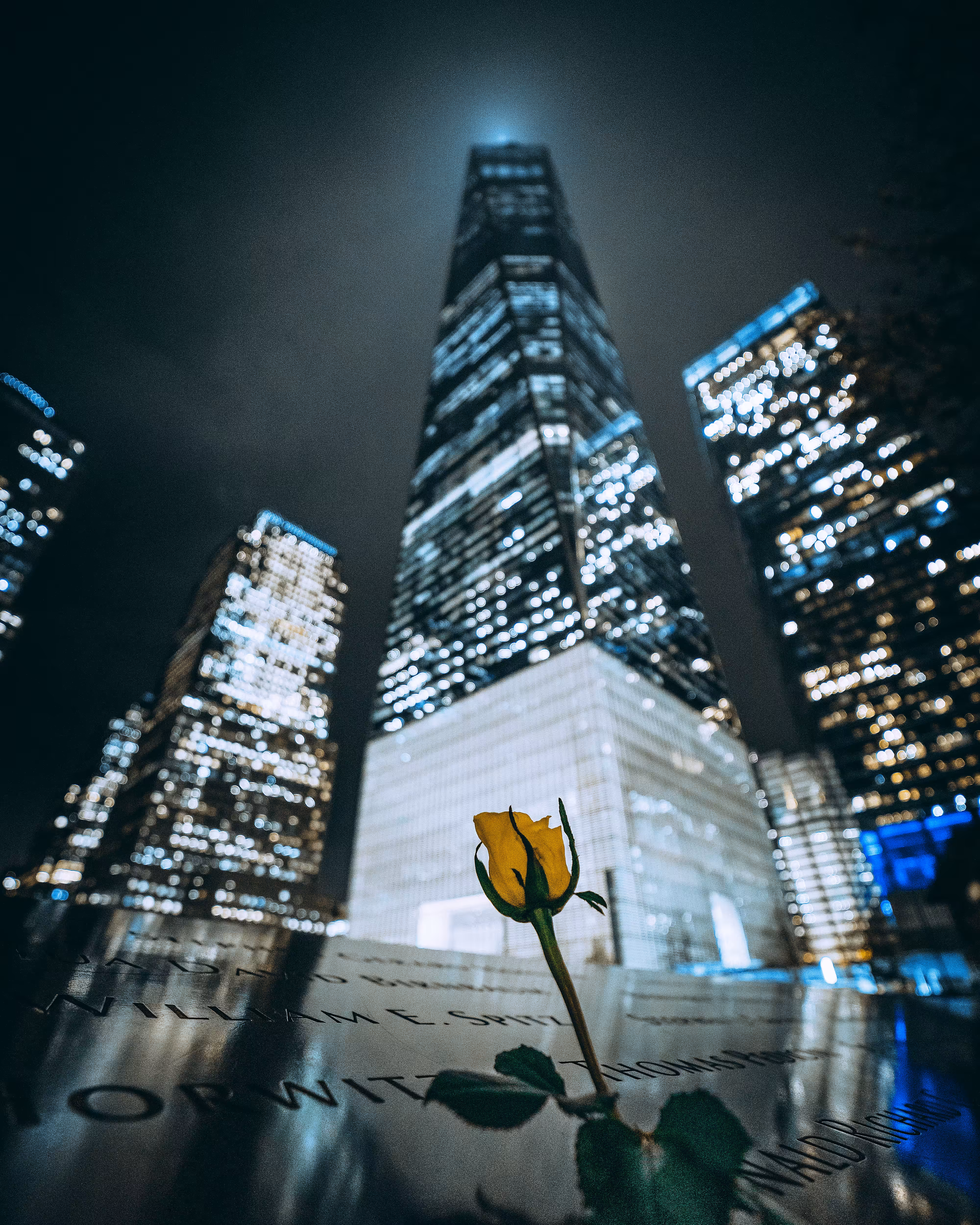 9/11 memorial with yellow rose