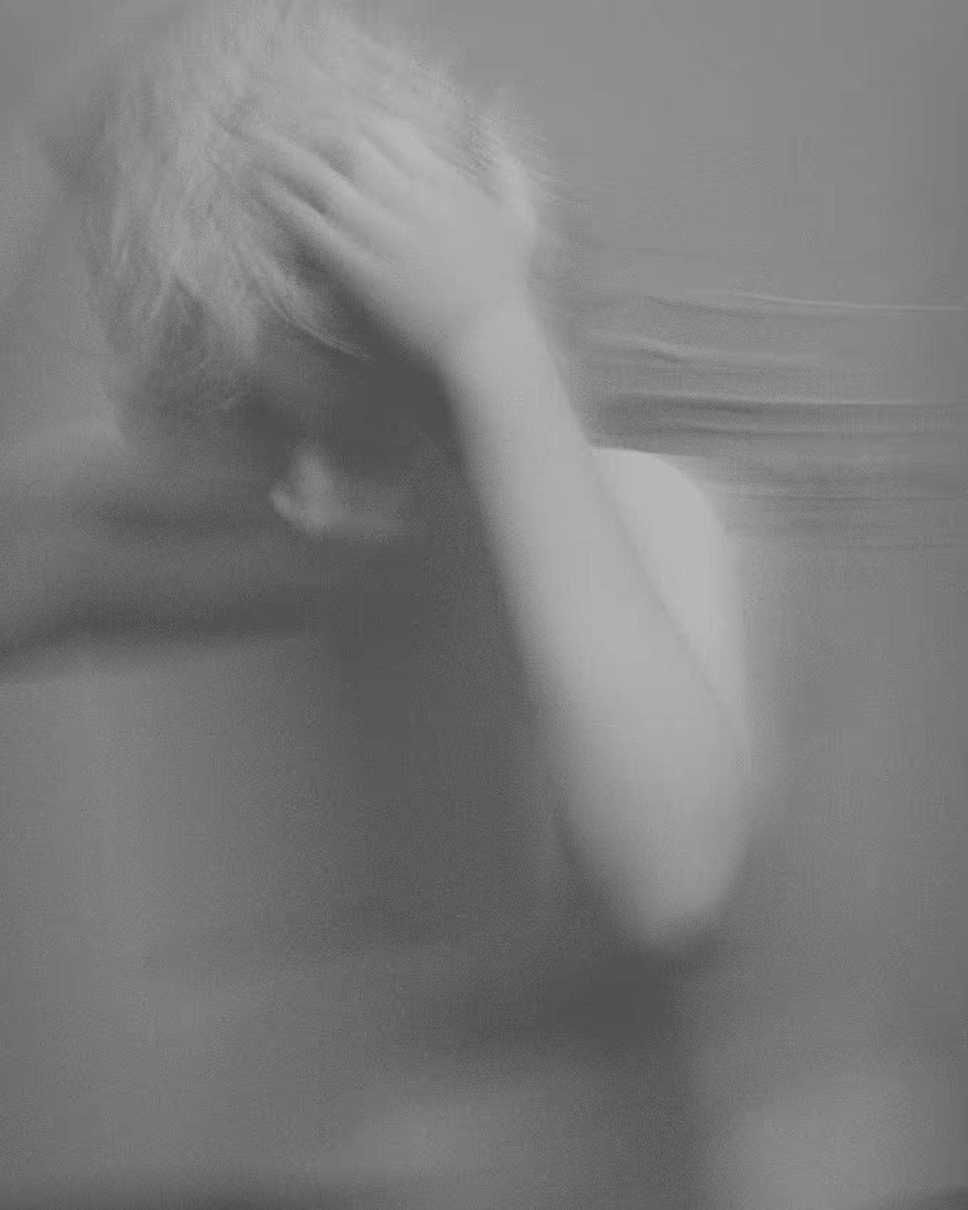 Young woman is washing her hair in the hotel room in clay