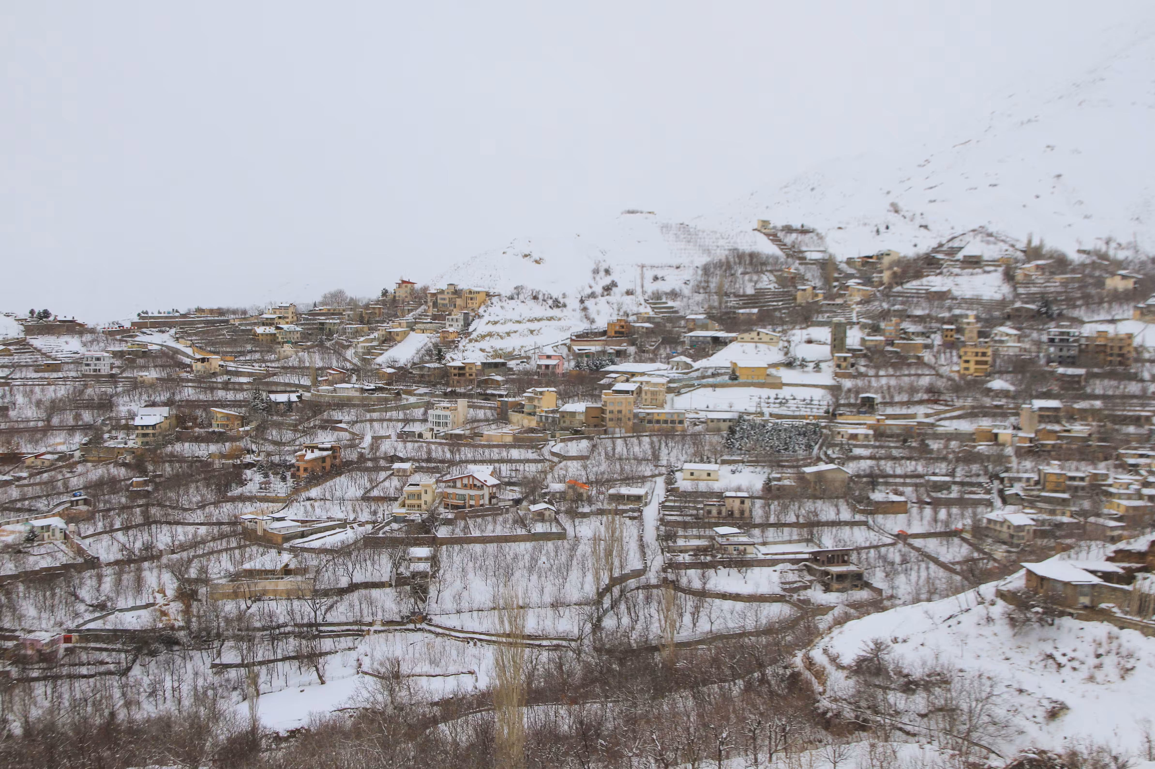 Snow-Covered Village on Mountain