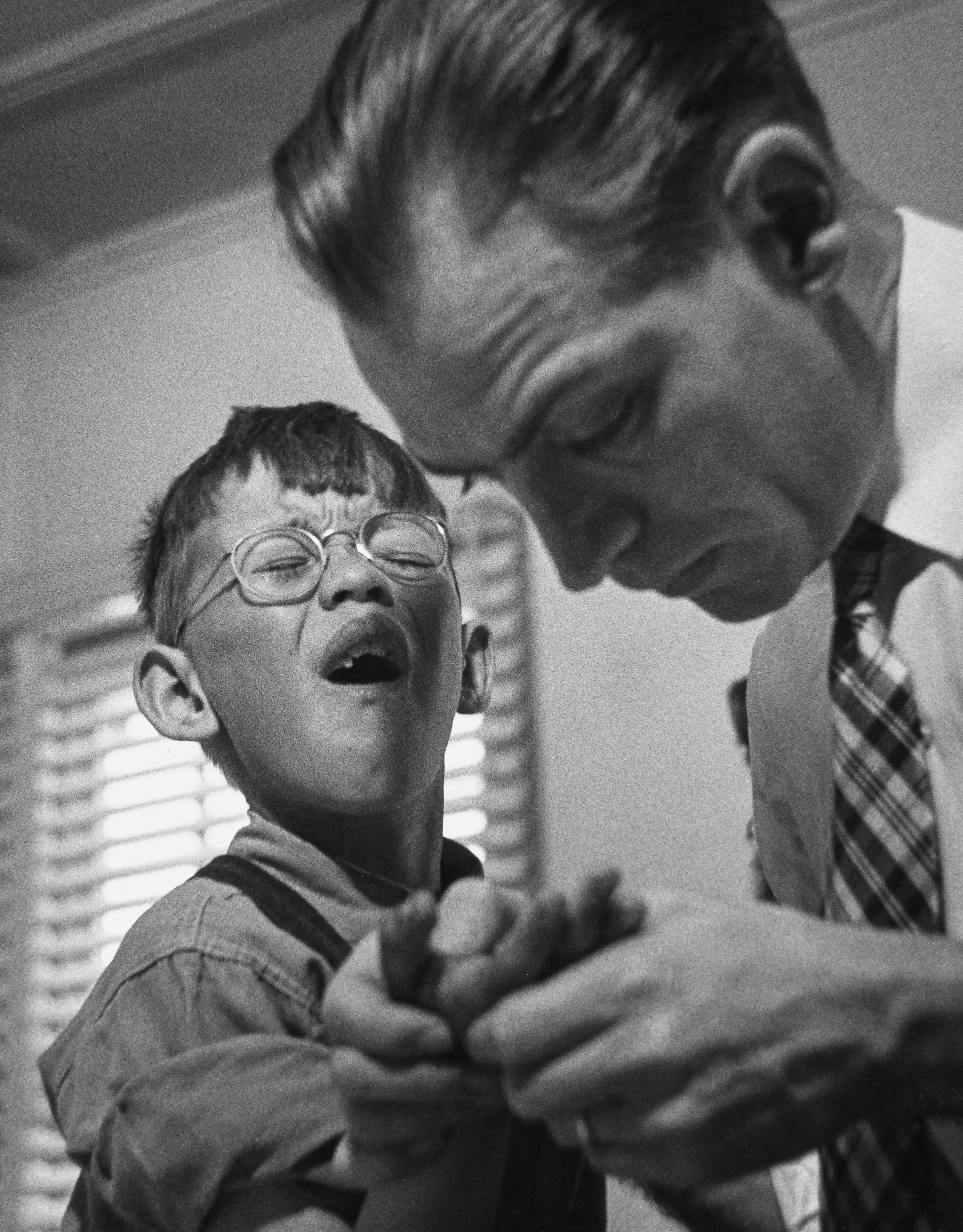 Country Doctor -  Dr. Ernest Ceriani Examining Boy's Injured Hand