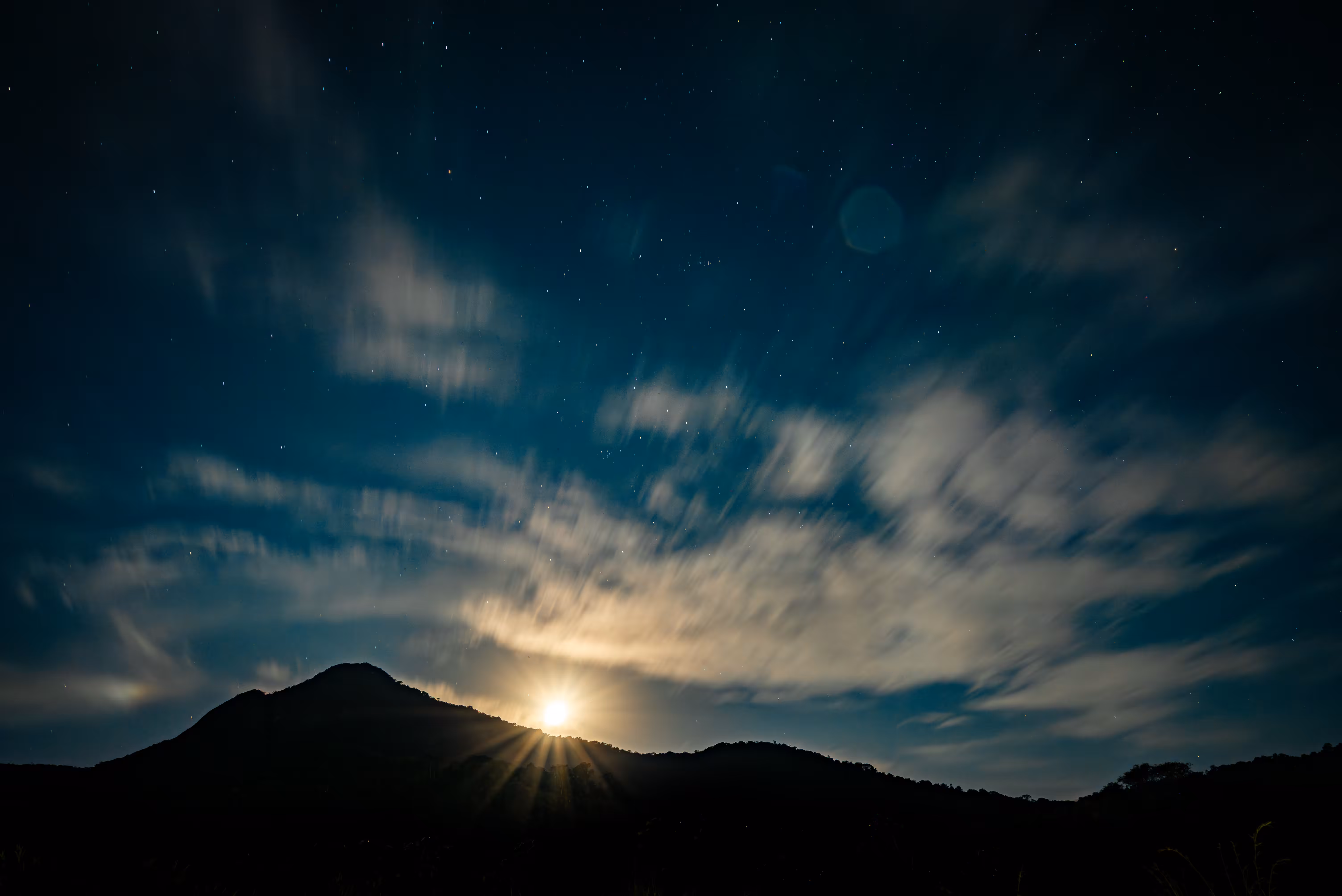 Moonrise Through the Cloud Veil