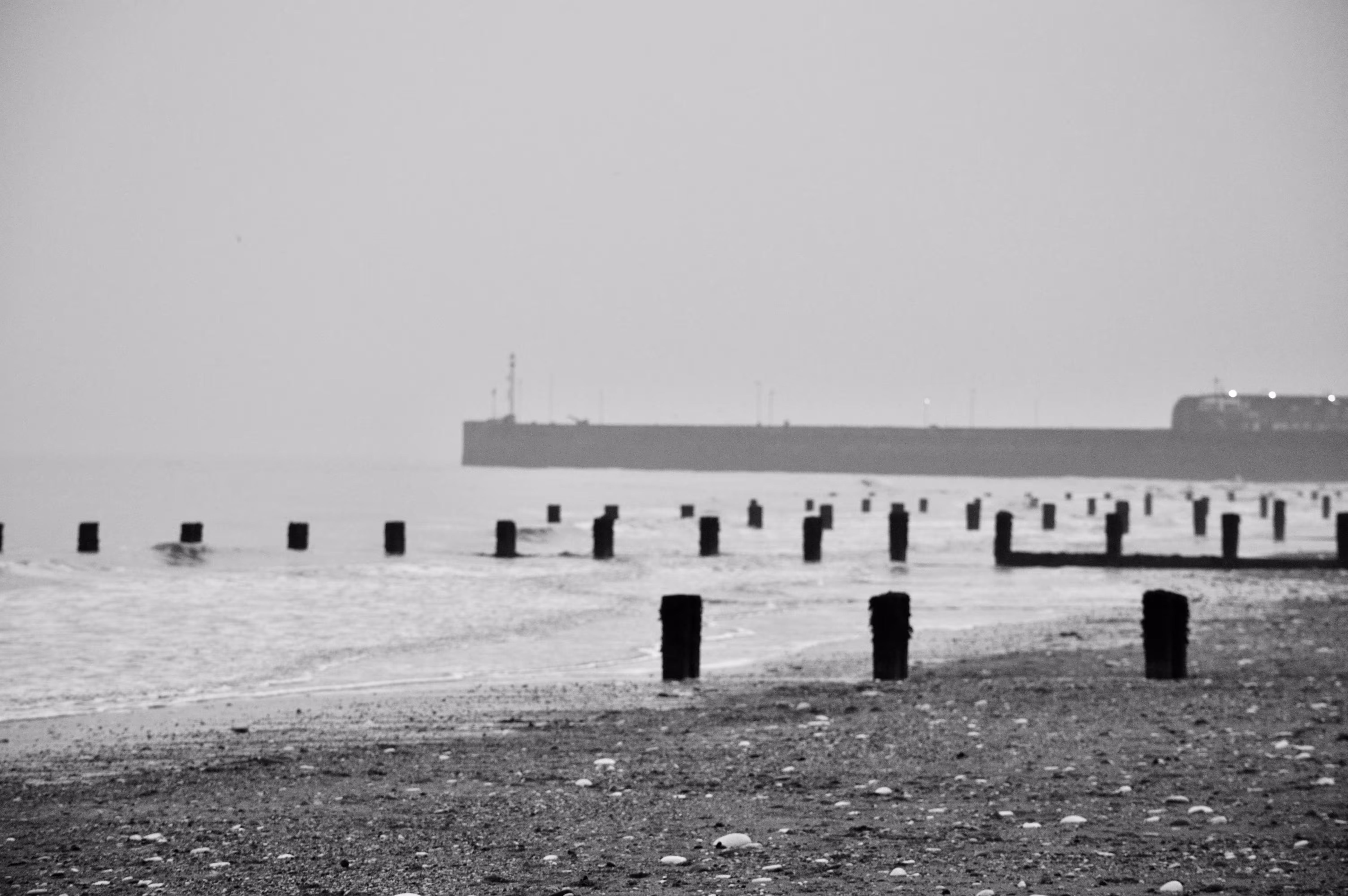 Trudging back over pebbles and sand