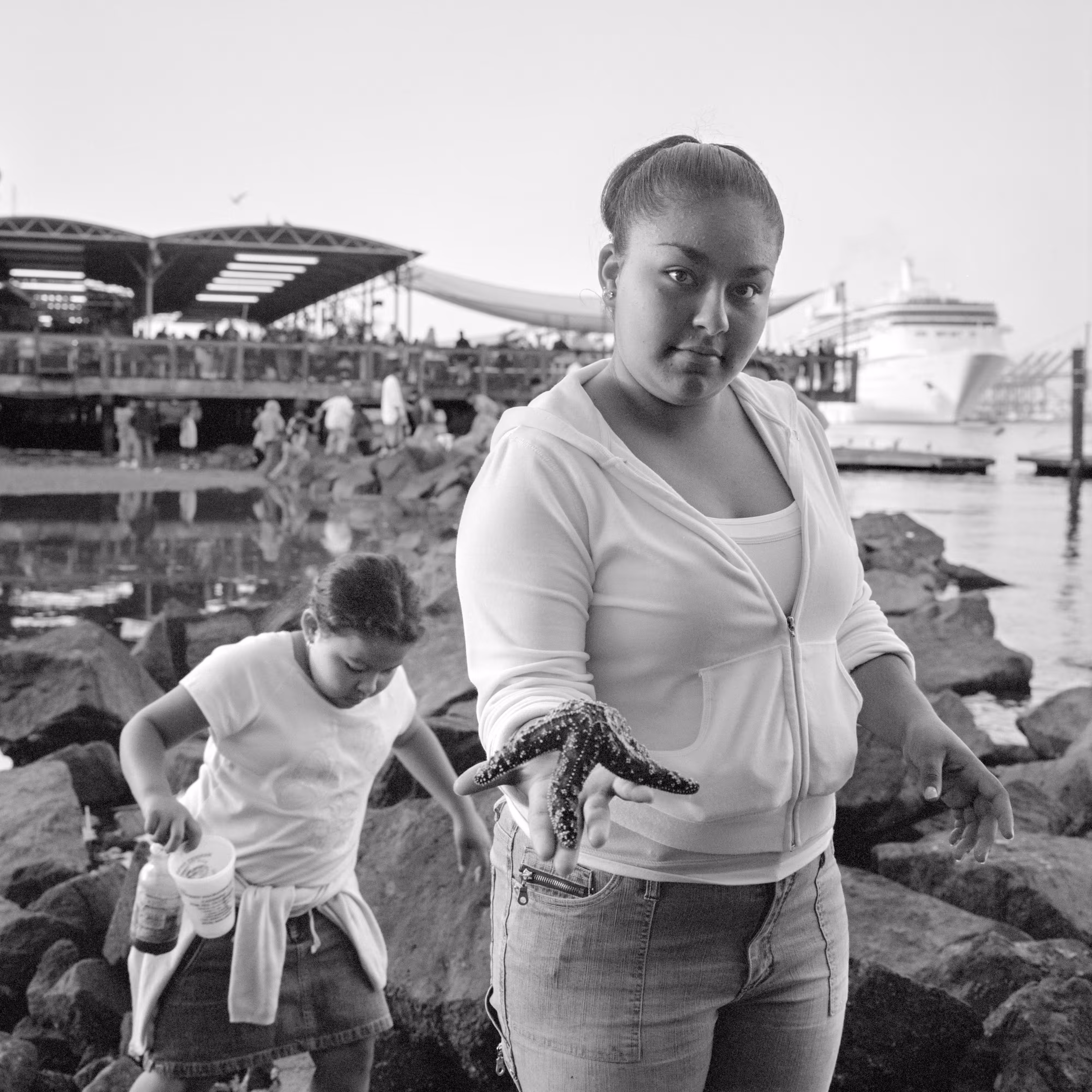 THE VILLAGE #32 WOMAN WITH STARFISH by Deanna Templeton