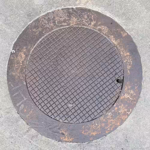 $100,000 Manhole Cover