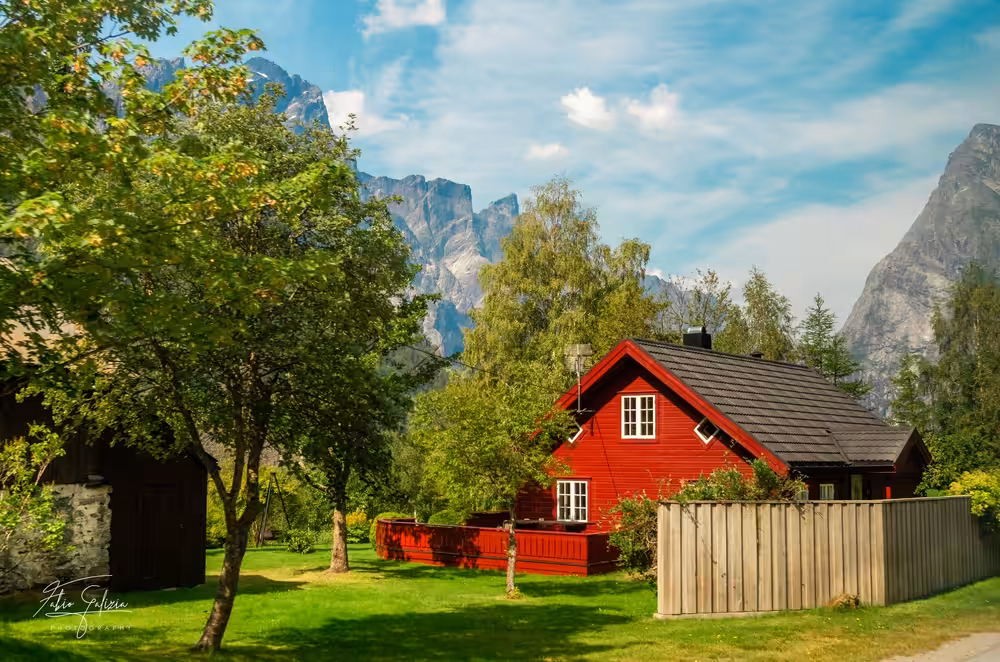 Red House in Norway throu mountains and sea