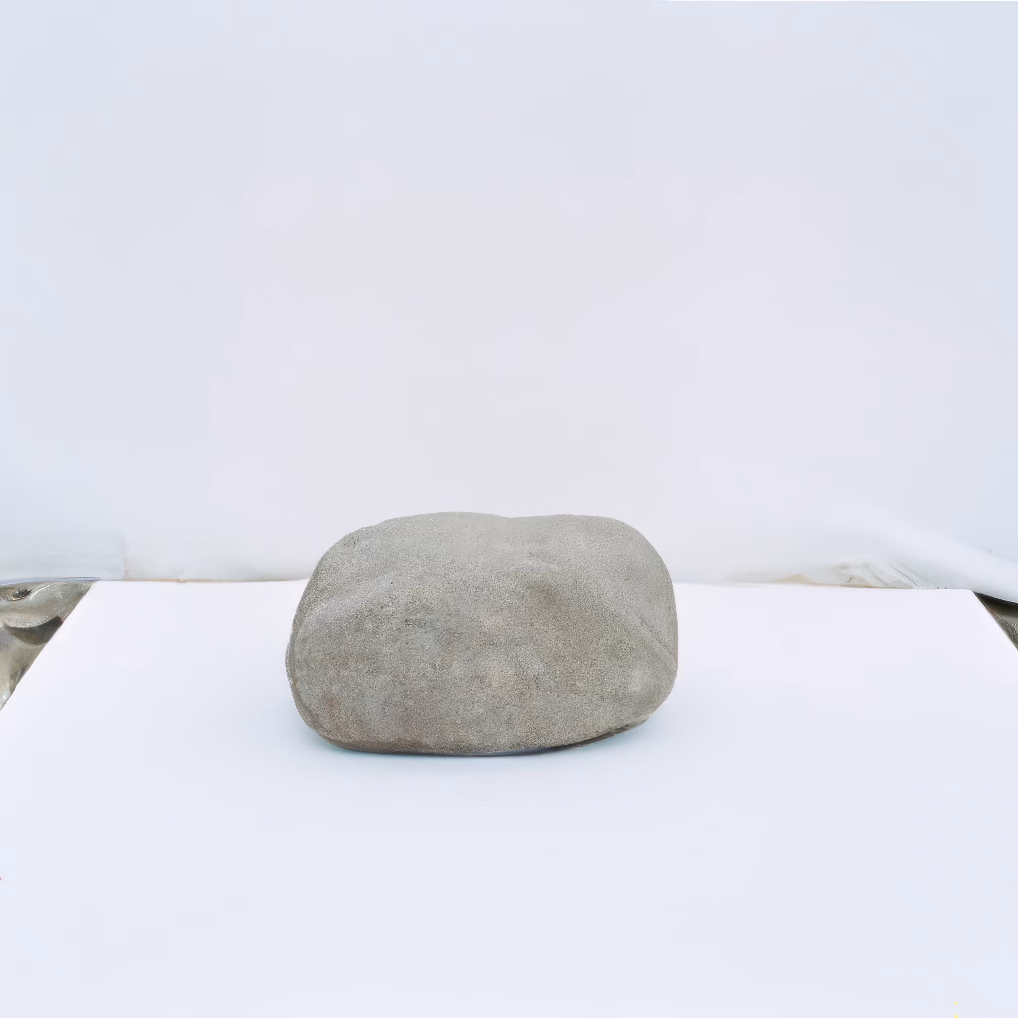 Stone on a white surface