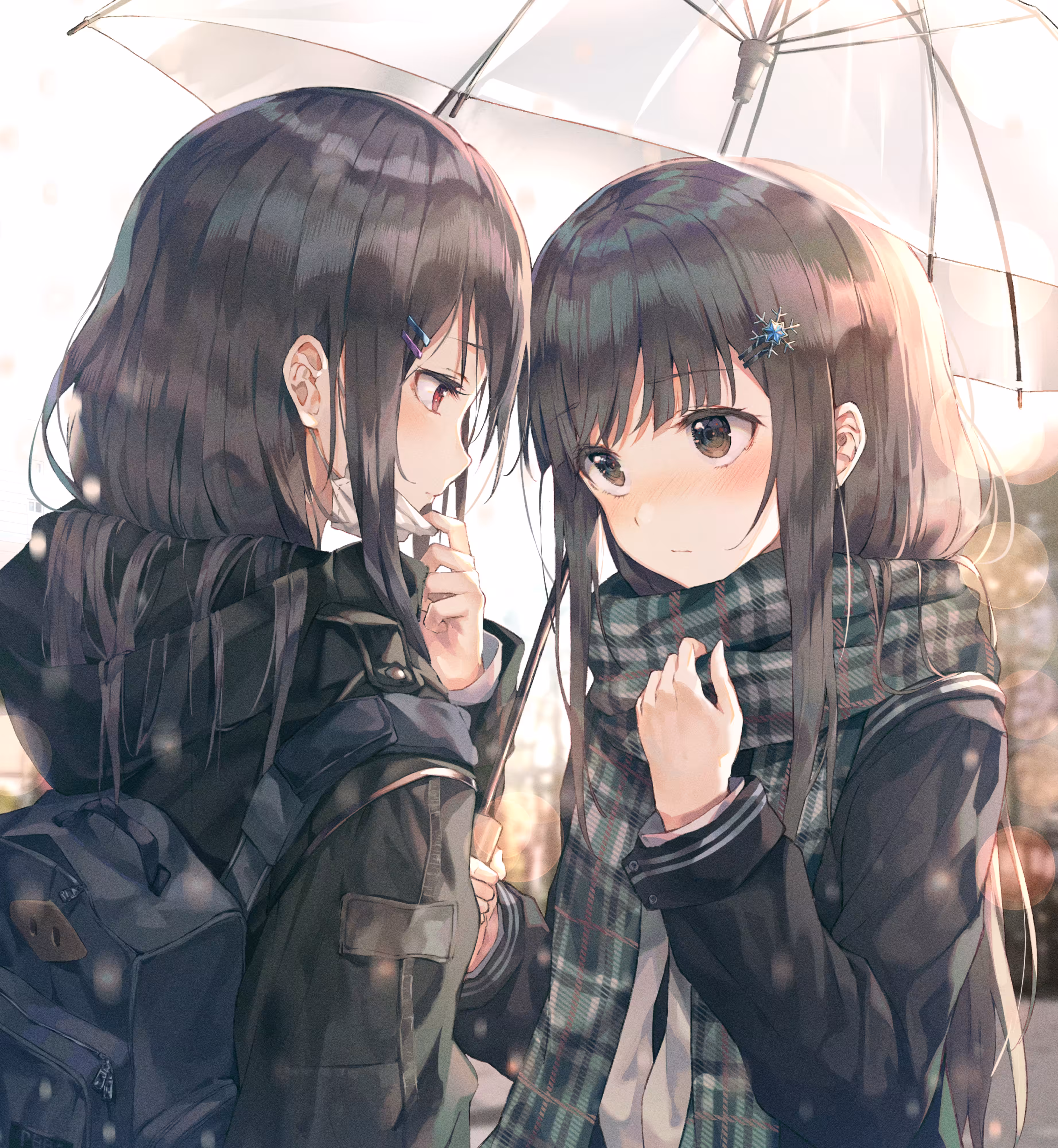 Two high school girls with umbrellas.