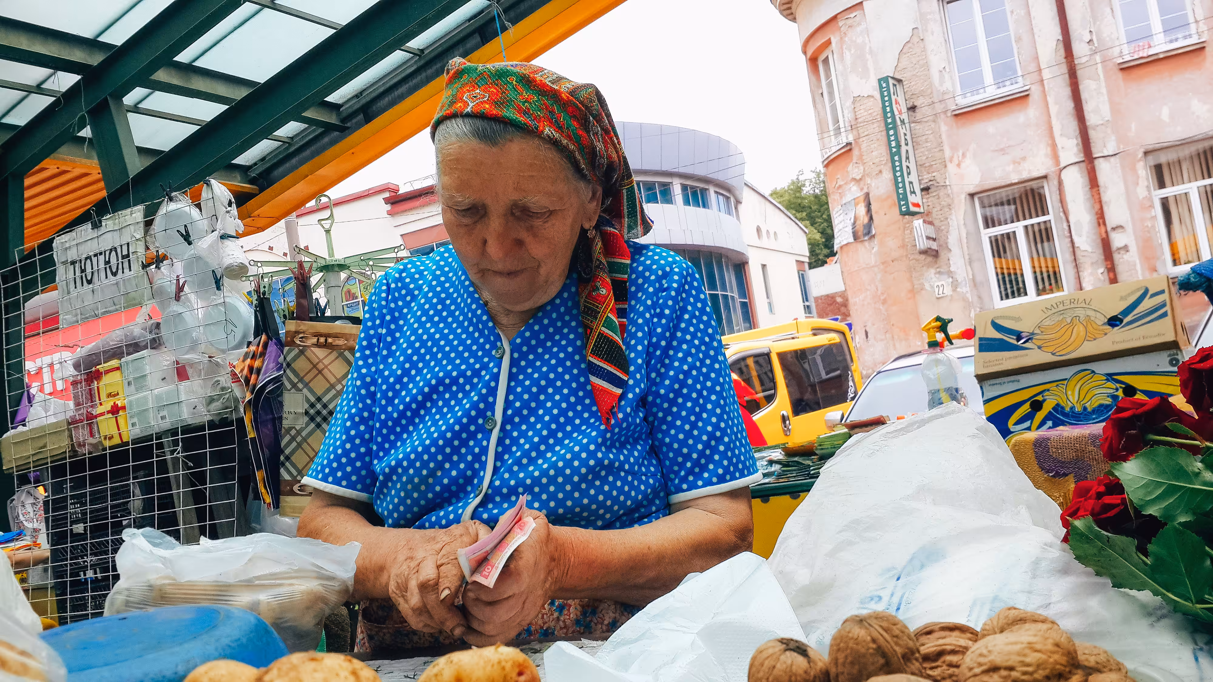 Granny in the market sells home potatoes, Ivano-Frankivsk, Ukraine